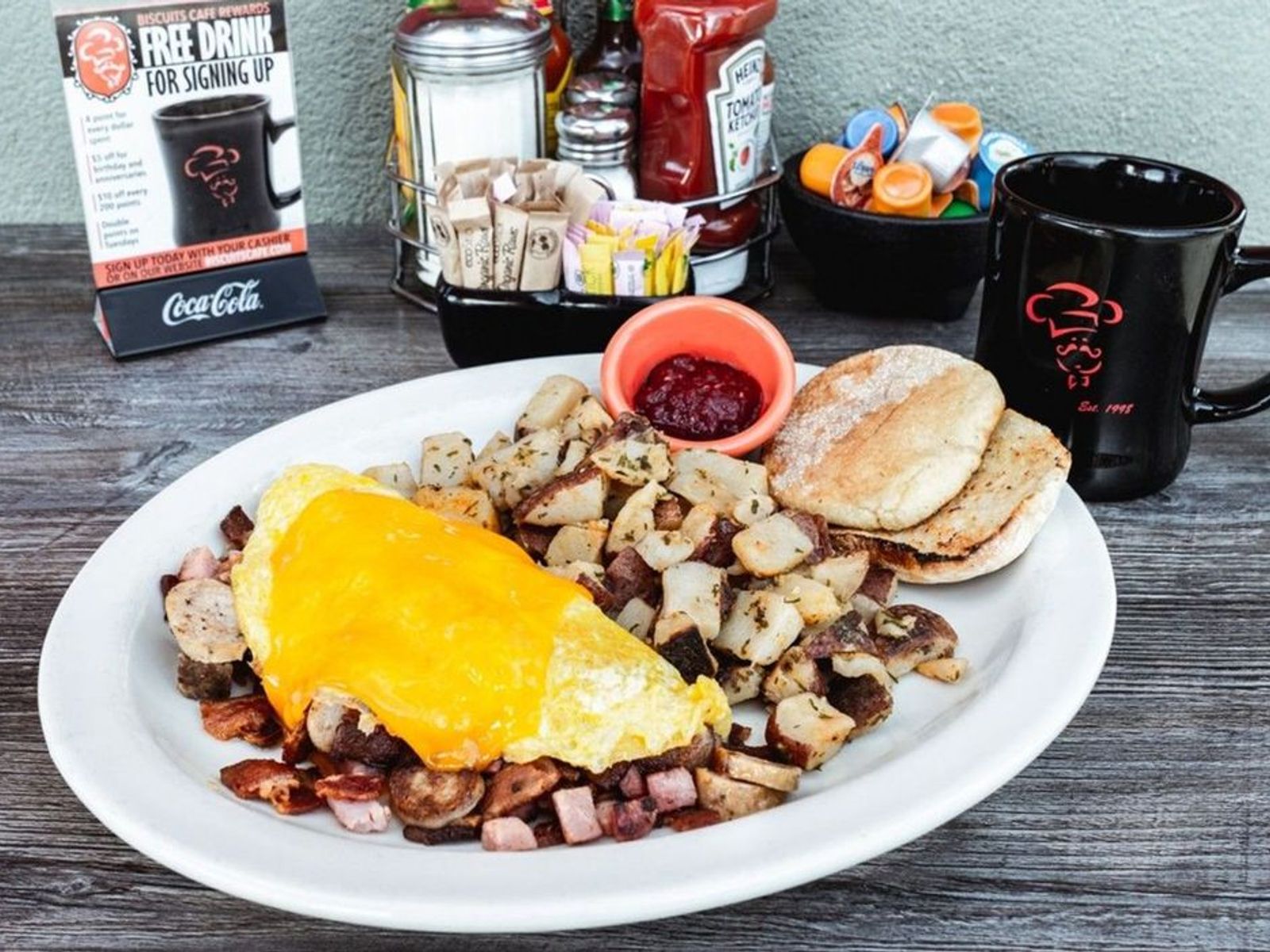 Order Meat Lovers Omelet- OO food online from Biscuits Cafe store, Chandler on bringmethat.com