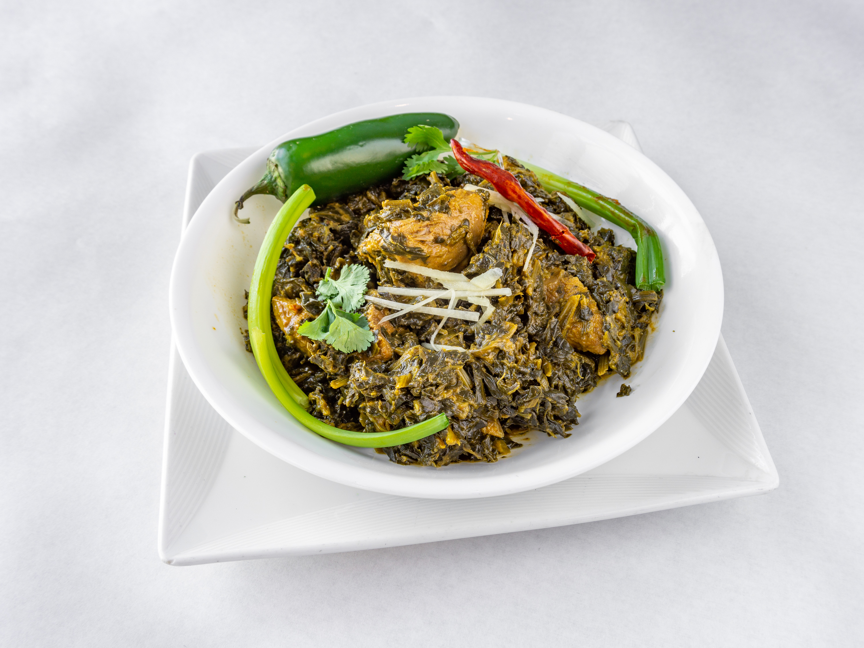 Order Lamb Saag food online from The Little India Restaurant store, Chicago on bringmethat.com