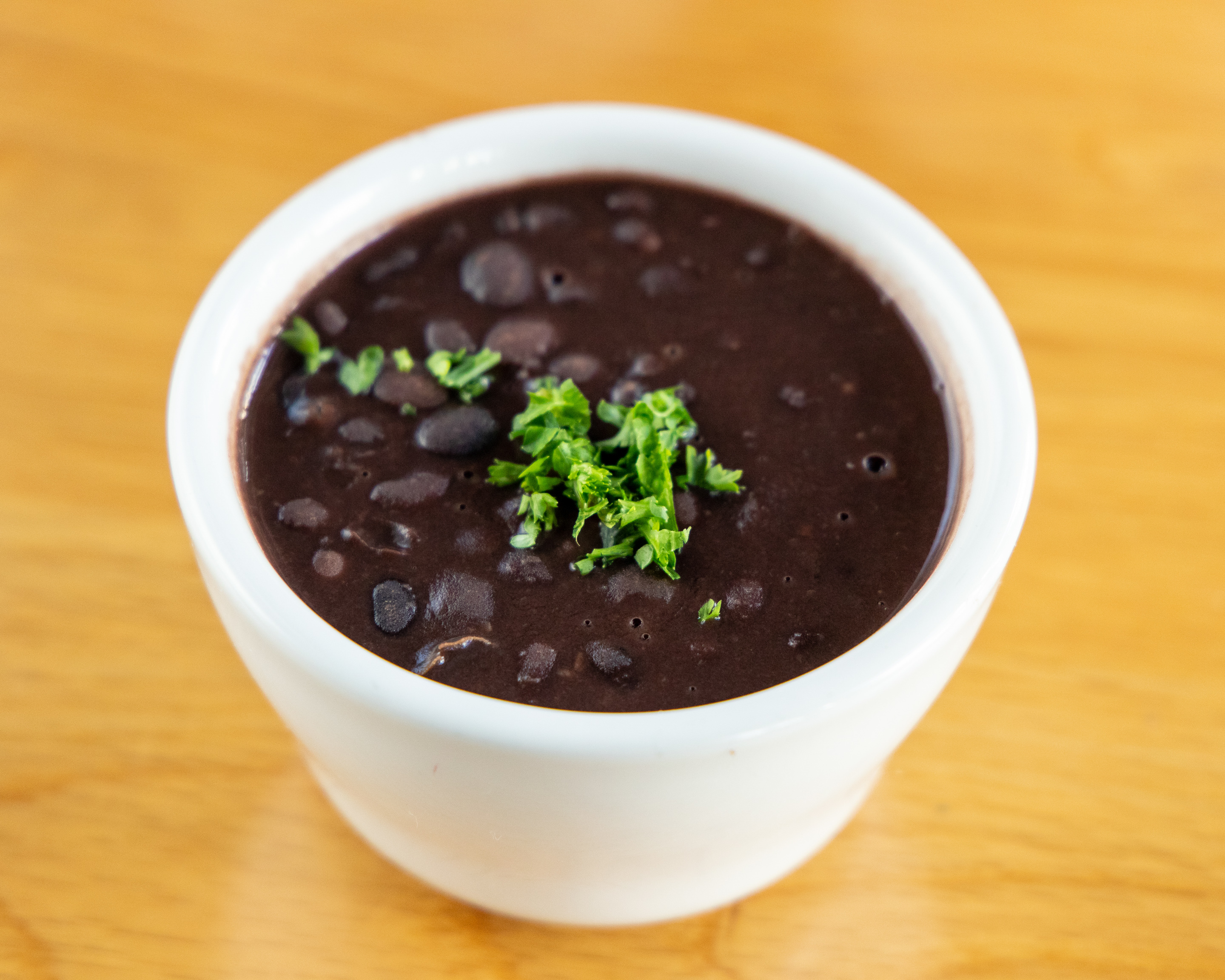 Order Black Beans (8 oz.) food online from Pampas Grill store, Los Angeles on bringmethat.com