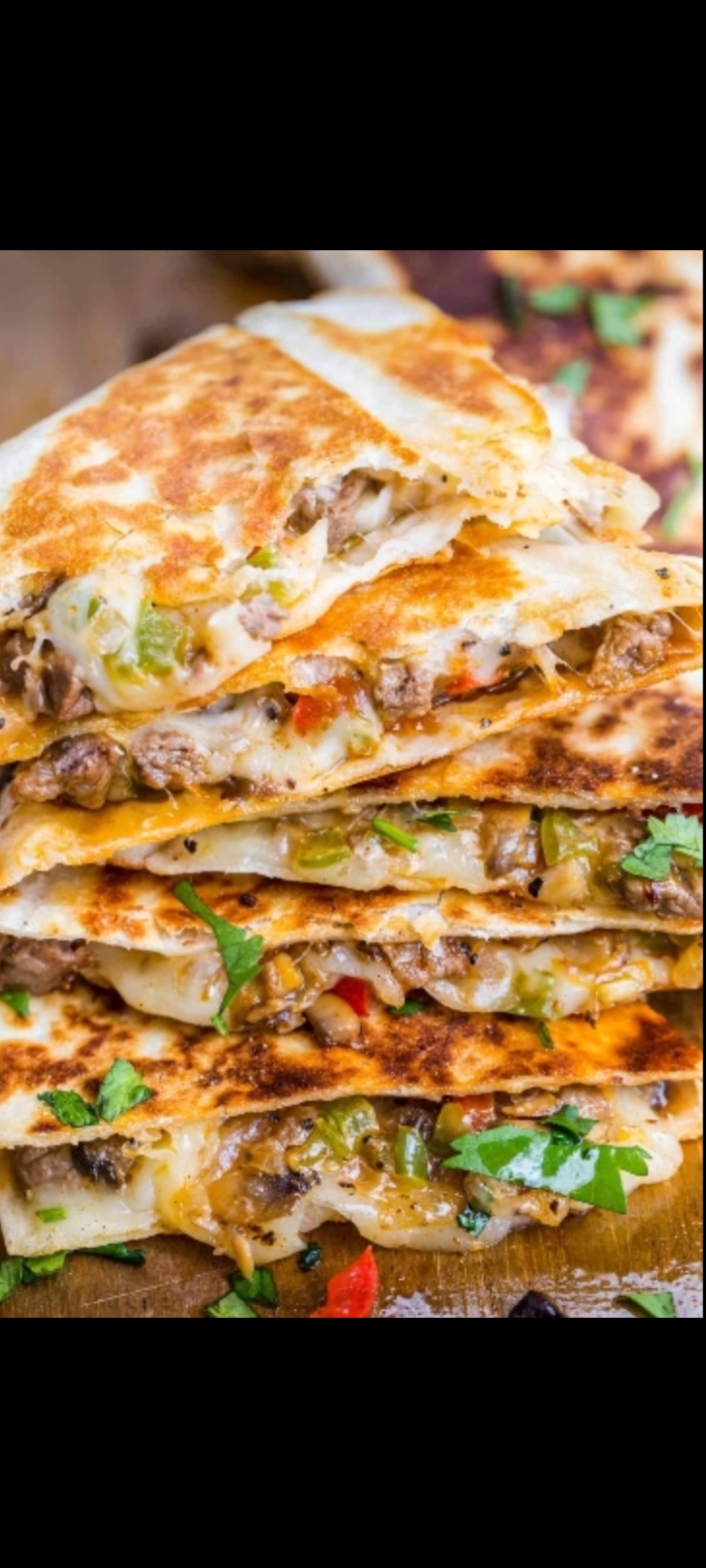 Order Philly Cheese Steak Quesadilla (thinly sliced & chopped beef strips, onions, peppers and your favorite cheese and side dressing) food online from American Gourmet Foods Deli store, New York on bringmethat.com