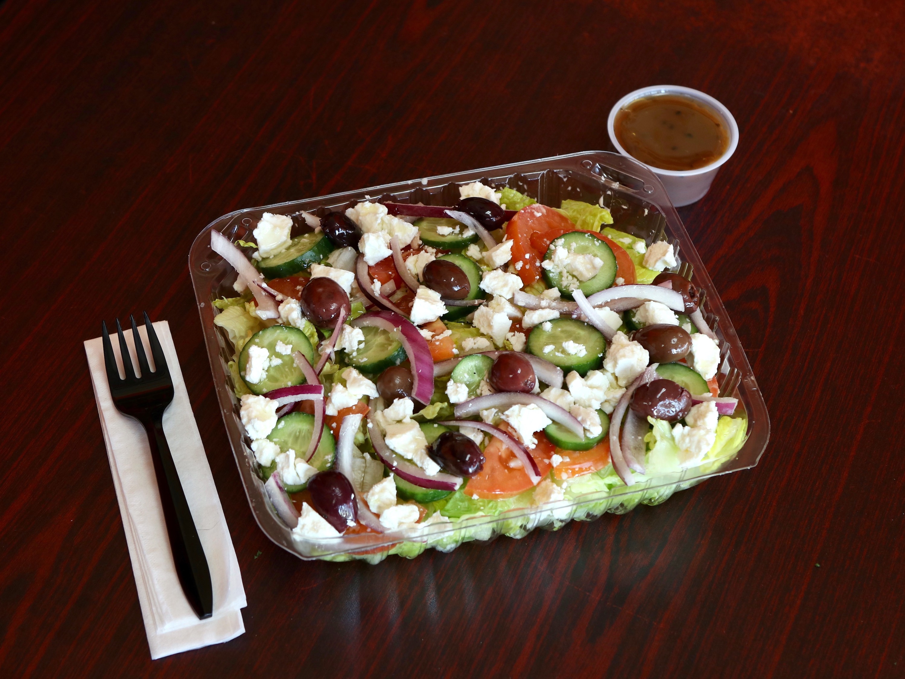 Order Greek Salad food online from Milano Flame Pizza & Pasta store, Reseda on bringmethat.com
