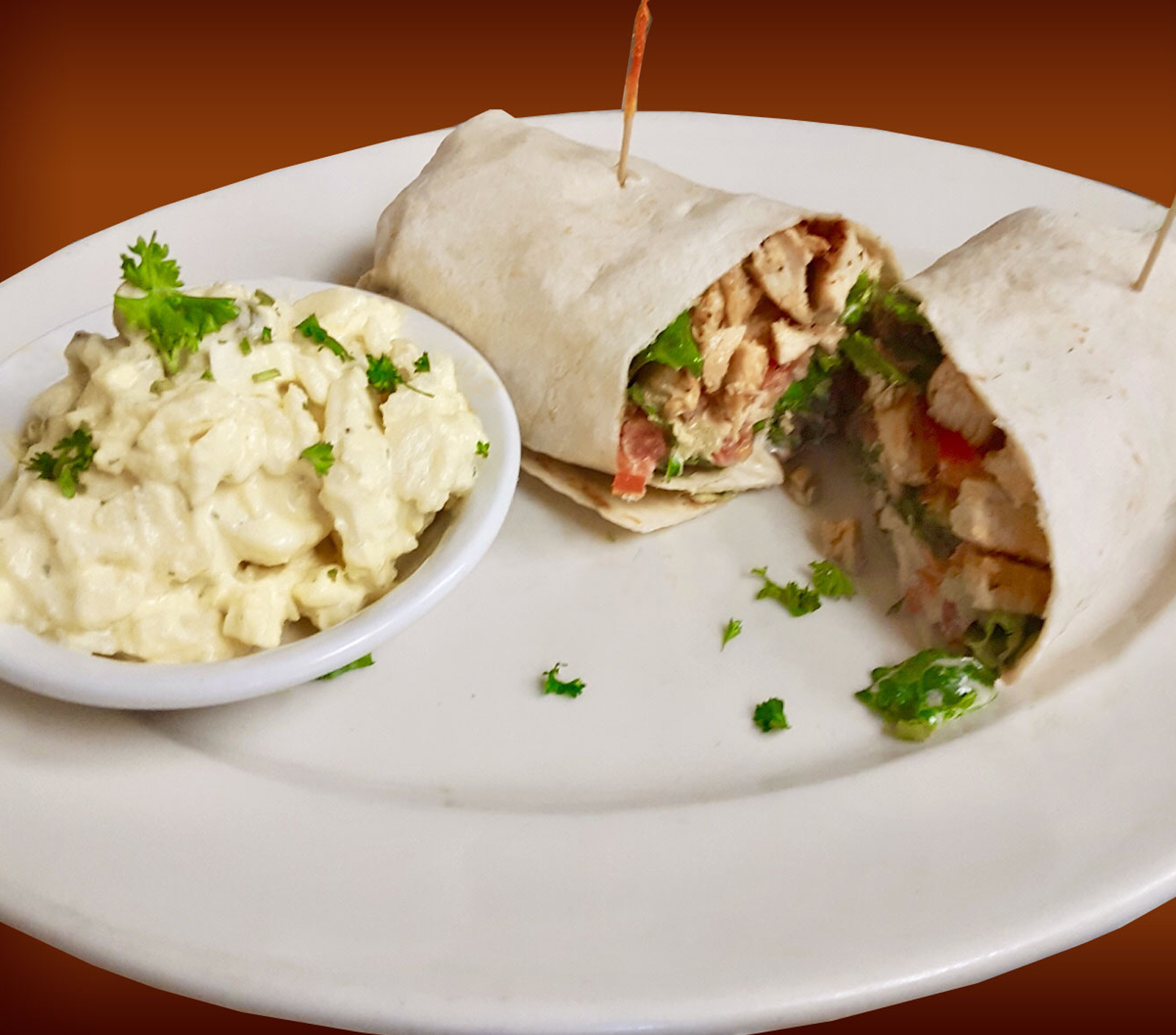 Order Cajun Chicken Caesar Wrap food online from Pinocchio In The Desert store, Palm Springs on bringmethat.com