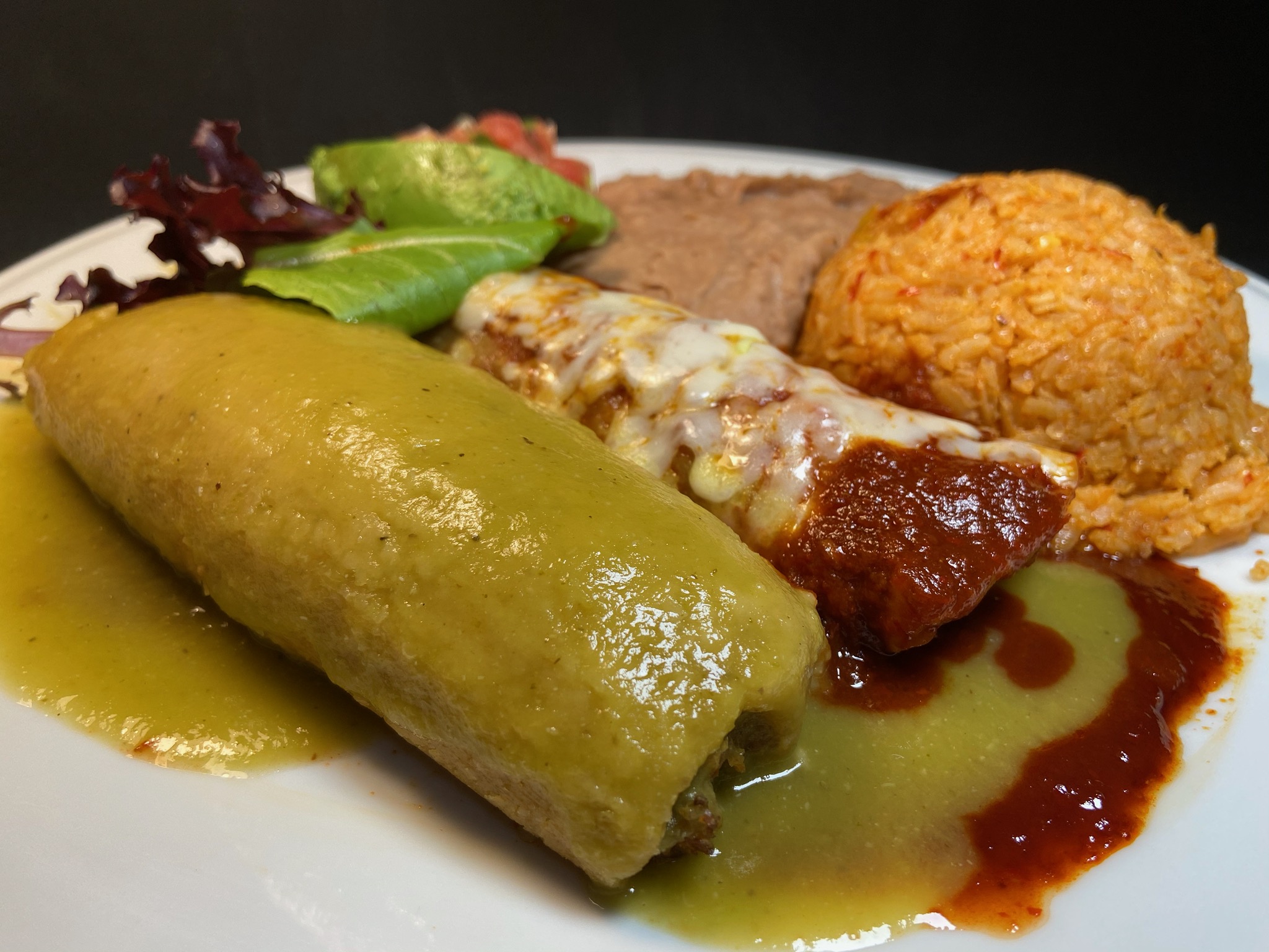Order Combination Plate (Enchilada & Tamale) food online from Adelita Taqueria Restaurant & Bar store, San Jose on bringmethat.com