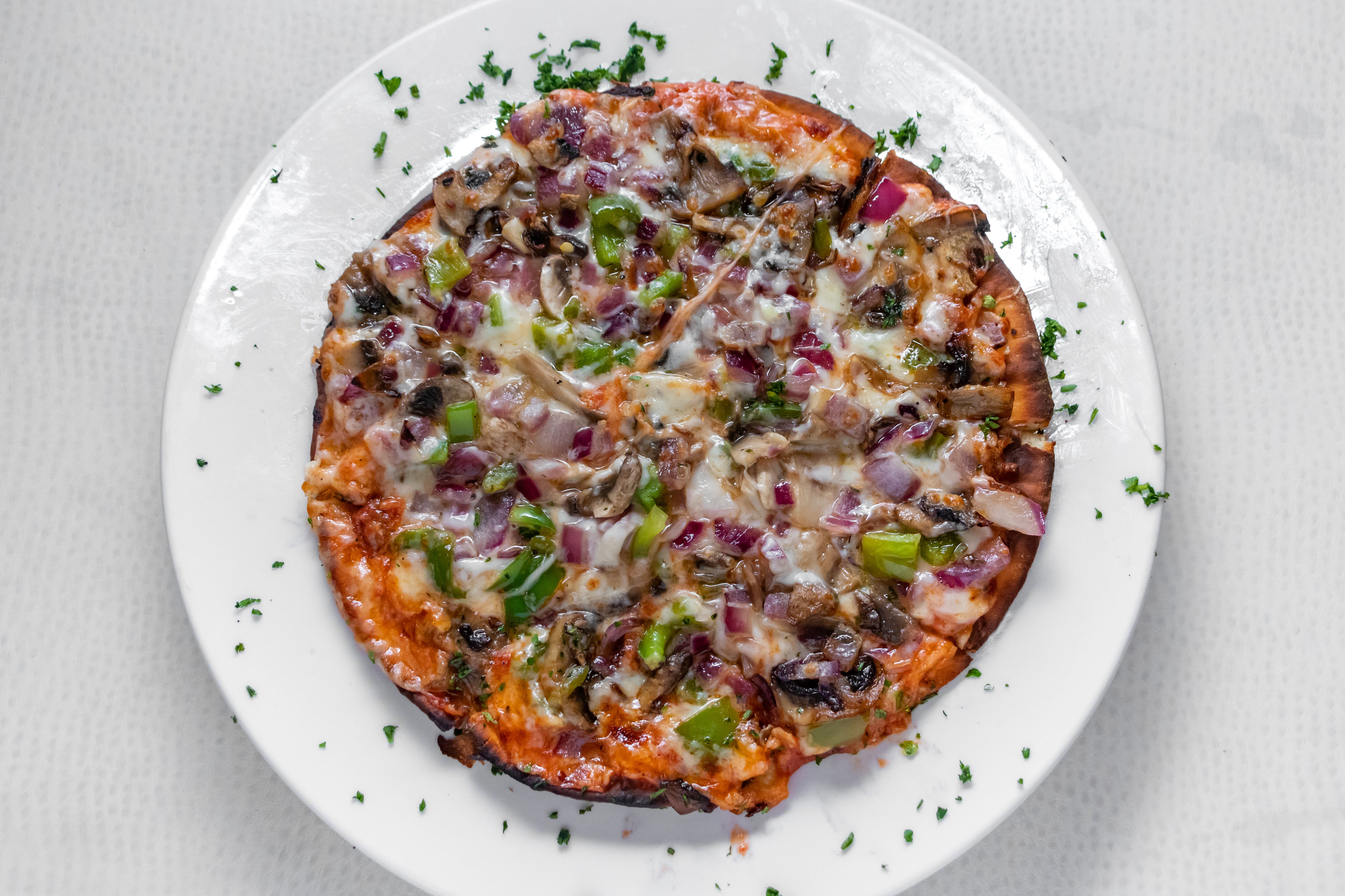 Order Judy's Favorite Pizza - 10'' (8 Slices) food online from Prima Pasta Restaurant store, Houston on bringmethat.com