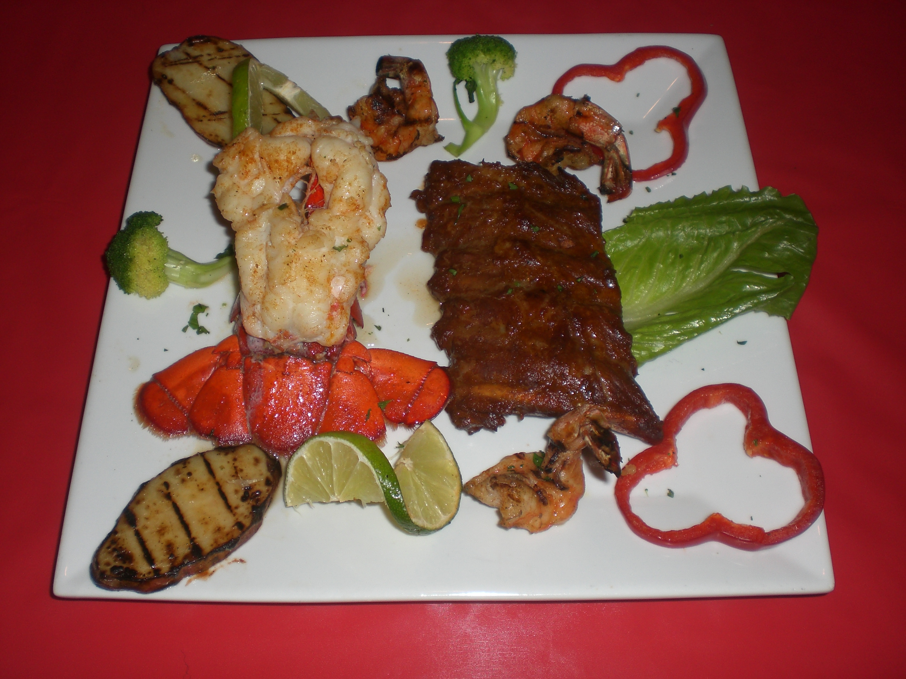 Order 1/2 RACK BAY BACK RIBS LOBSTER TAIL&3 SHRIMP* food online from Caridad and Louie Restaurant Corp store, Bronx on bringmethat.com