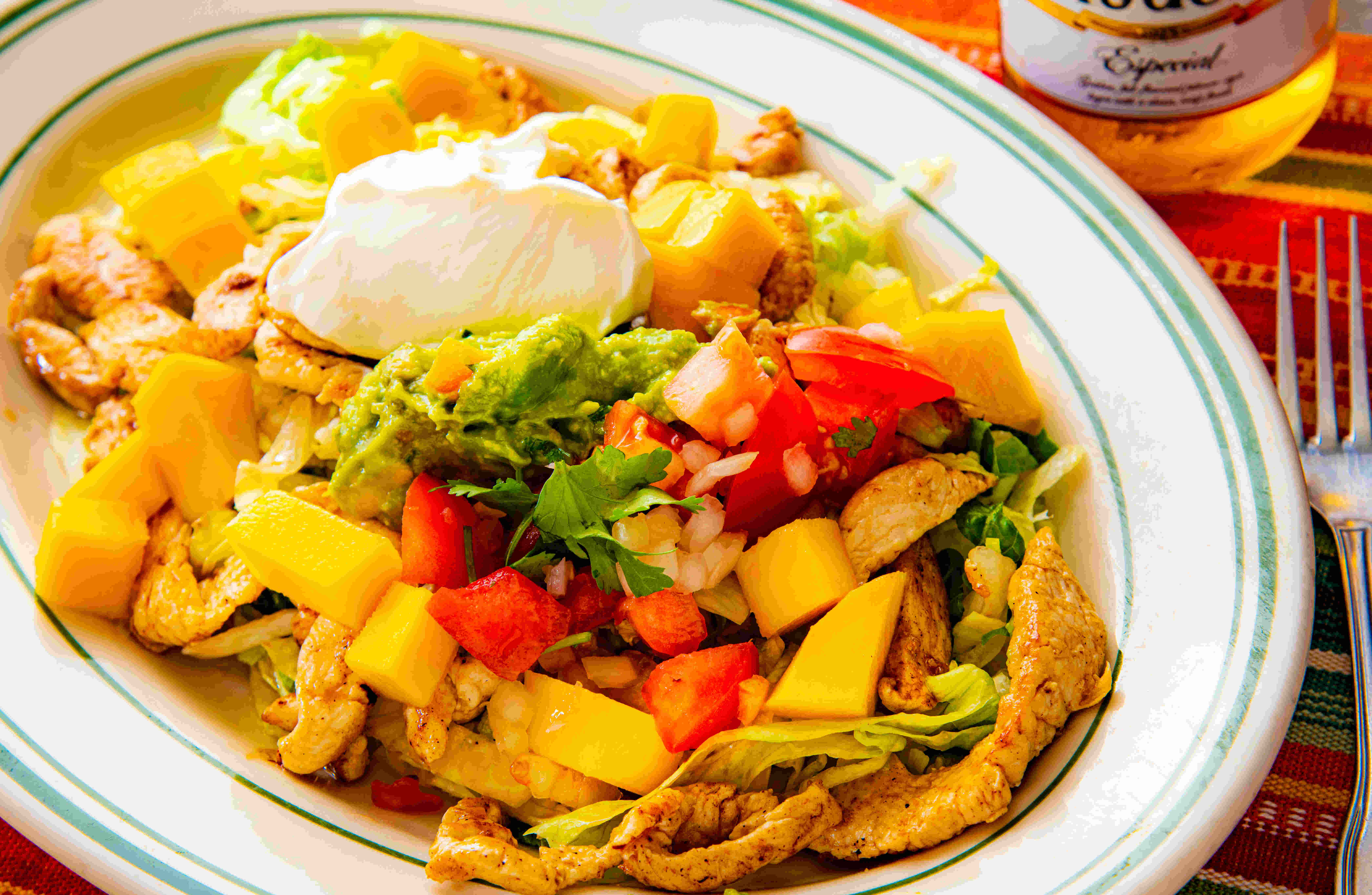 Order Mango Tostada with Grilled Chicken food online from Los Tres Chiles store, Santa Rosa on bringmethat.com