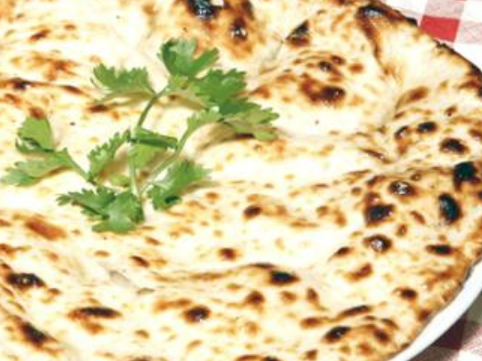 Order Tandoori Naan (No Butter) food online from Curry Home store, Pittsburgh on bringmethat.com
