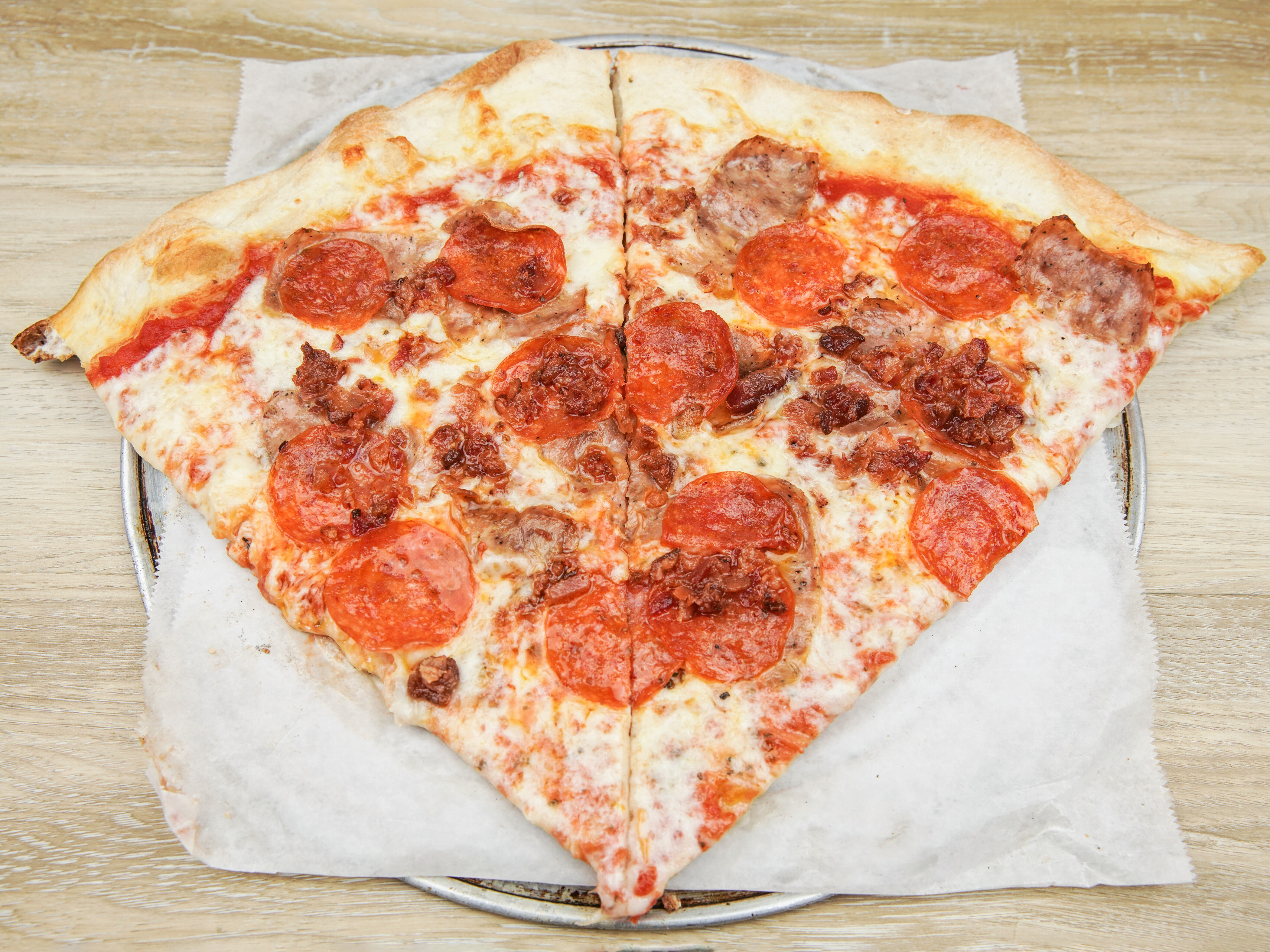 Order Meat Lovers Pizza food online from Bronx Pie Pizza store, Poughkeepsie on bringmethat.com
