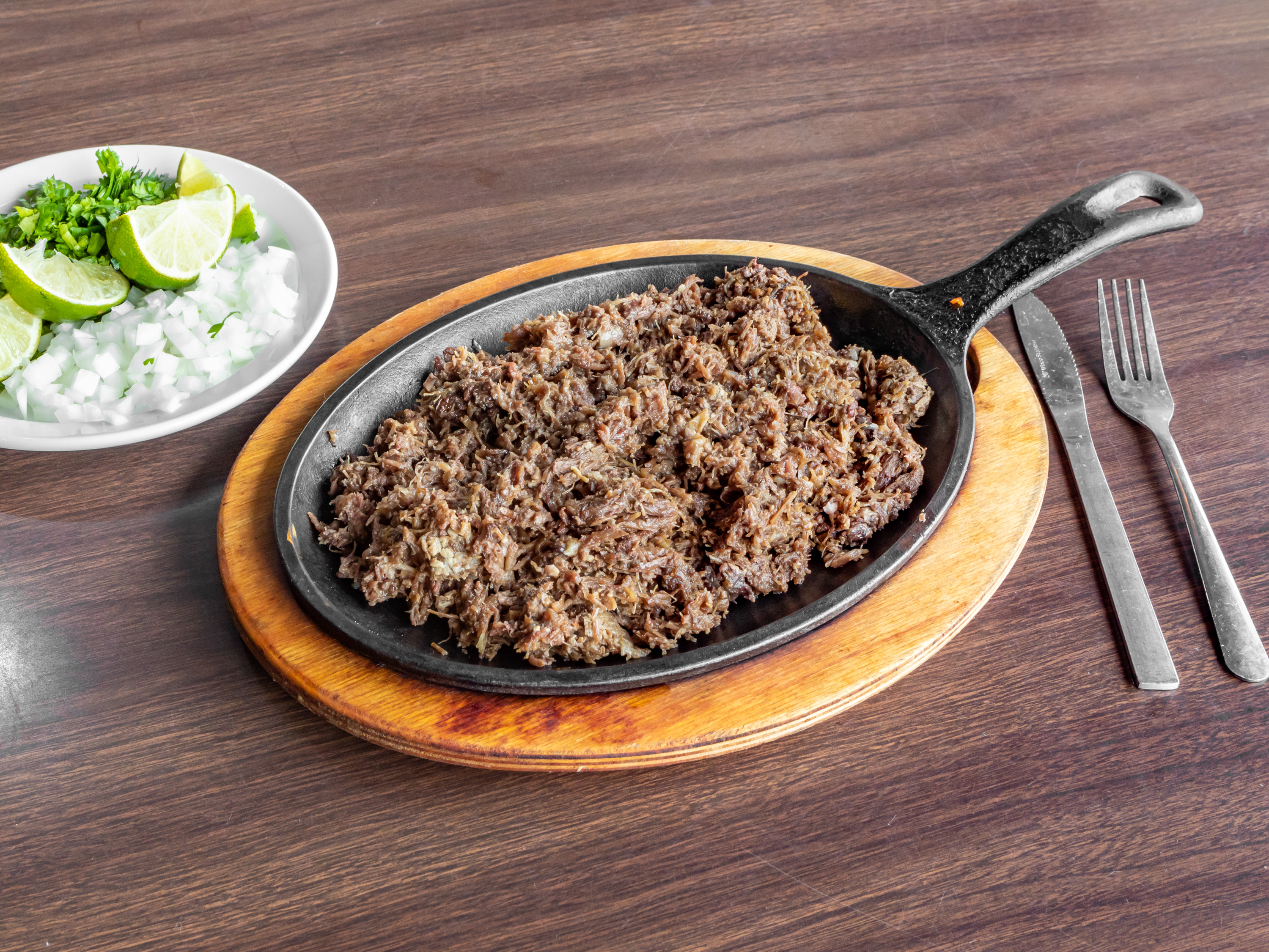 Order Pound of Barbacoa food online from El Rincon store, Pflugerville on bringmethat.com