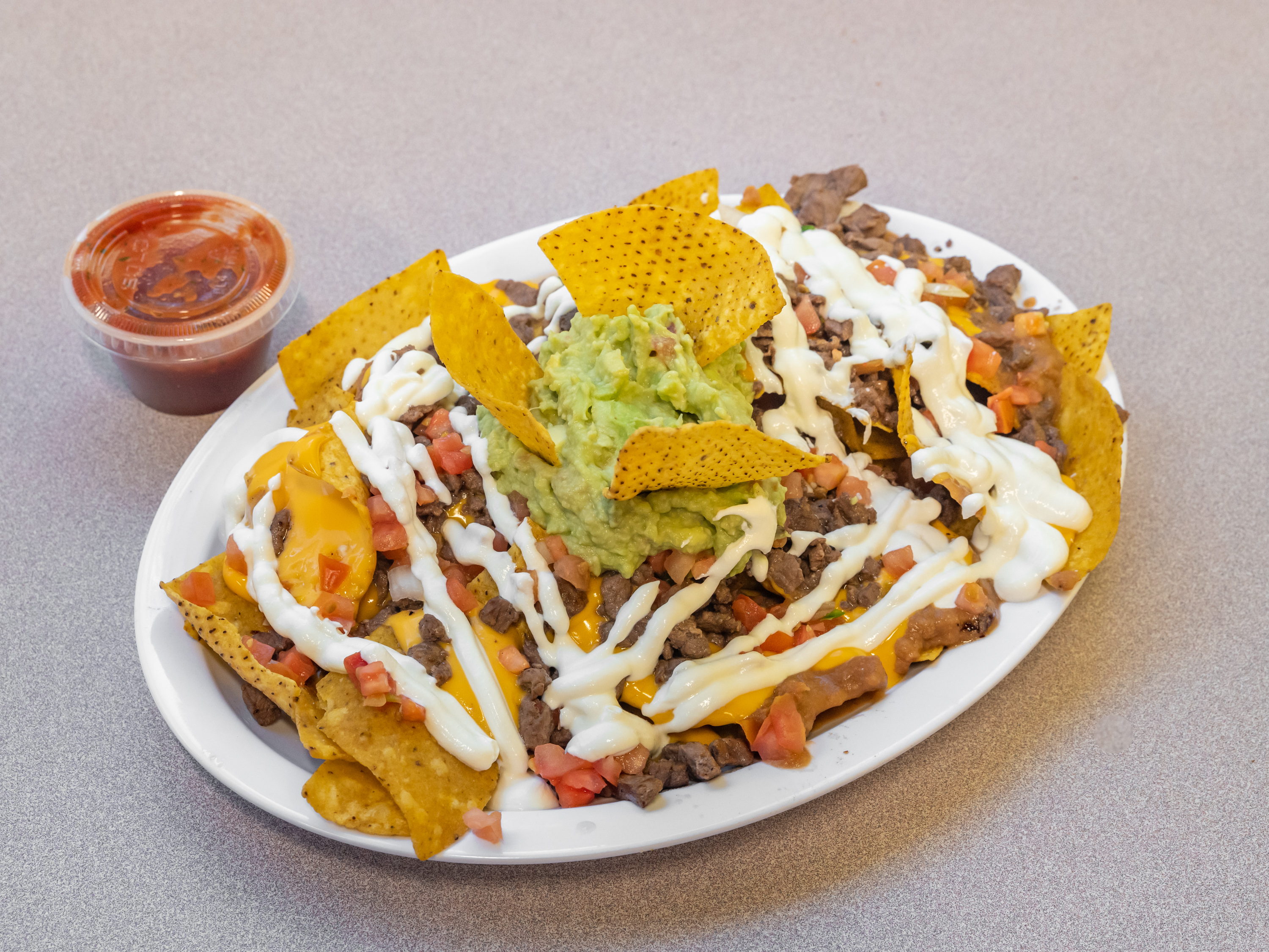 Order Nachos Supreme food online from Taco King - W Liberty St. store, Ann Arbor on bringmethat.com