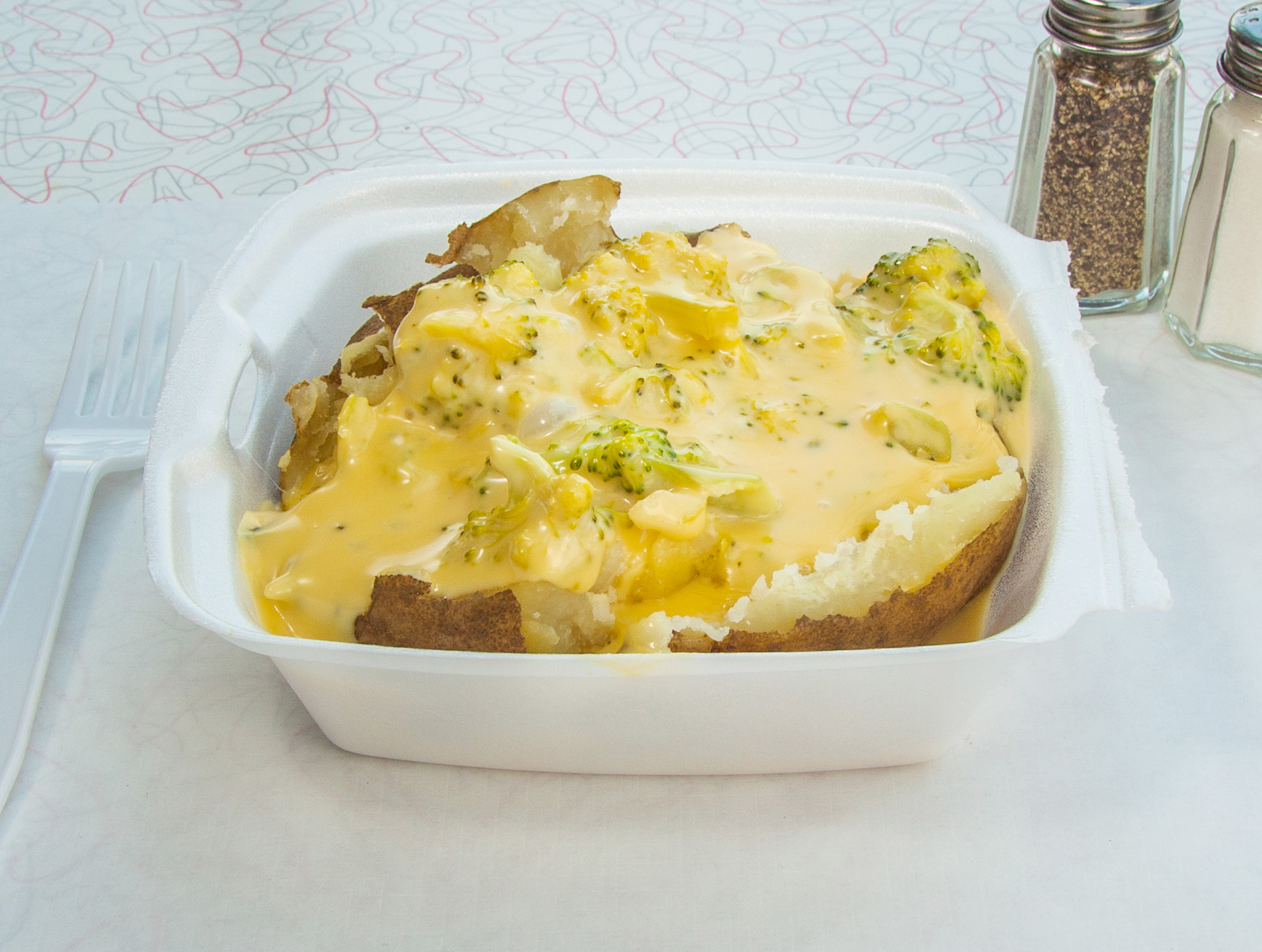 Order Broccoli and Cheese Baked Potato food online from Rax store, Joliet on bringmethat.com