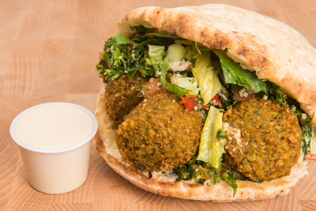 Order Falafel Pita Falafel in a pita with a choice of two salads food online from The Green Chicpea store, Newark on bringmethat.com