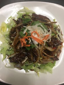 Order E12. Nua Kratiam Prig food online from Lemongrass Cafe store, Louisville on bringmethat.com