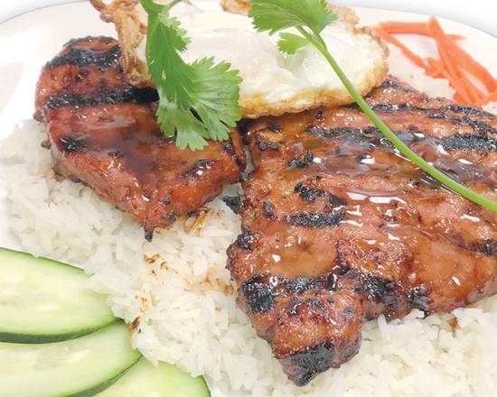 Order 49. Grilled Pork Chop on Rice food online from Saigon District Restaurant store, Huntington Beach on bringmethat.com
