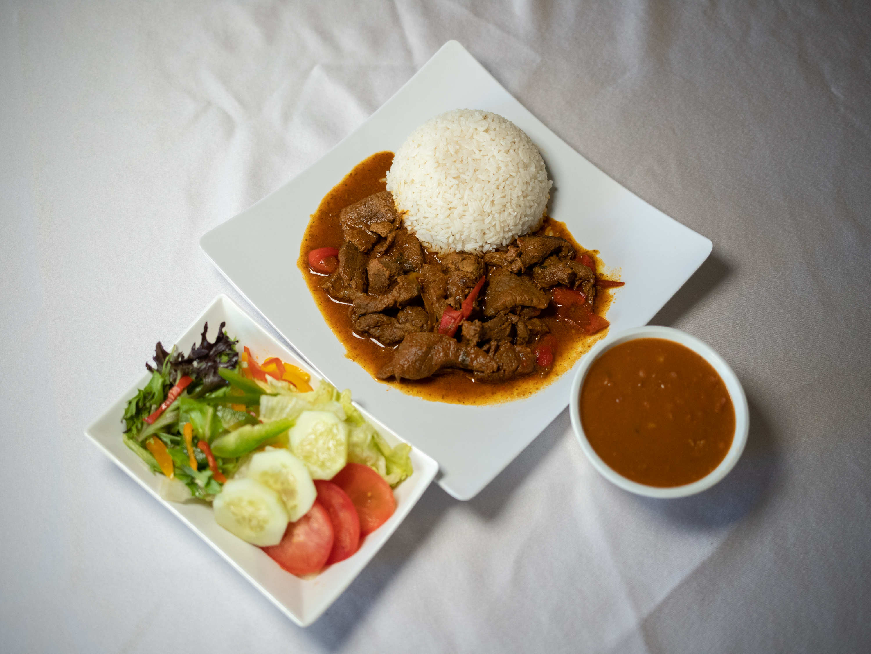 Order Beef Stew/ carne guisada food online from Lo Nuestro Dominican Restaurant store, Albany on bringmethat.com