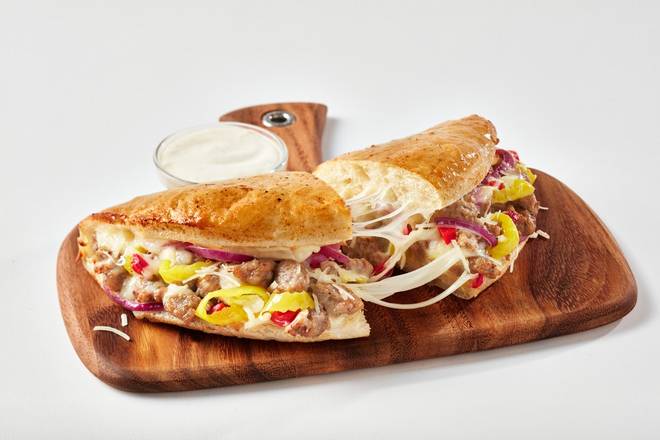 Order Sausage & Peppers Calzone food online from Schlotzsky's store, San Angelo on bringmethat.com