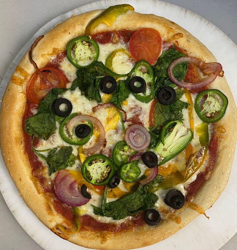 Order Veggie Special Pizza food online from Desi Food Galaxy store, Somerset on bringmethat.com