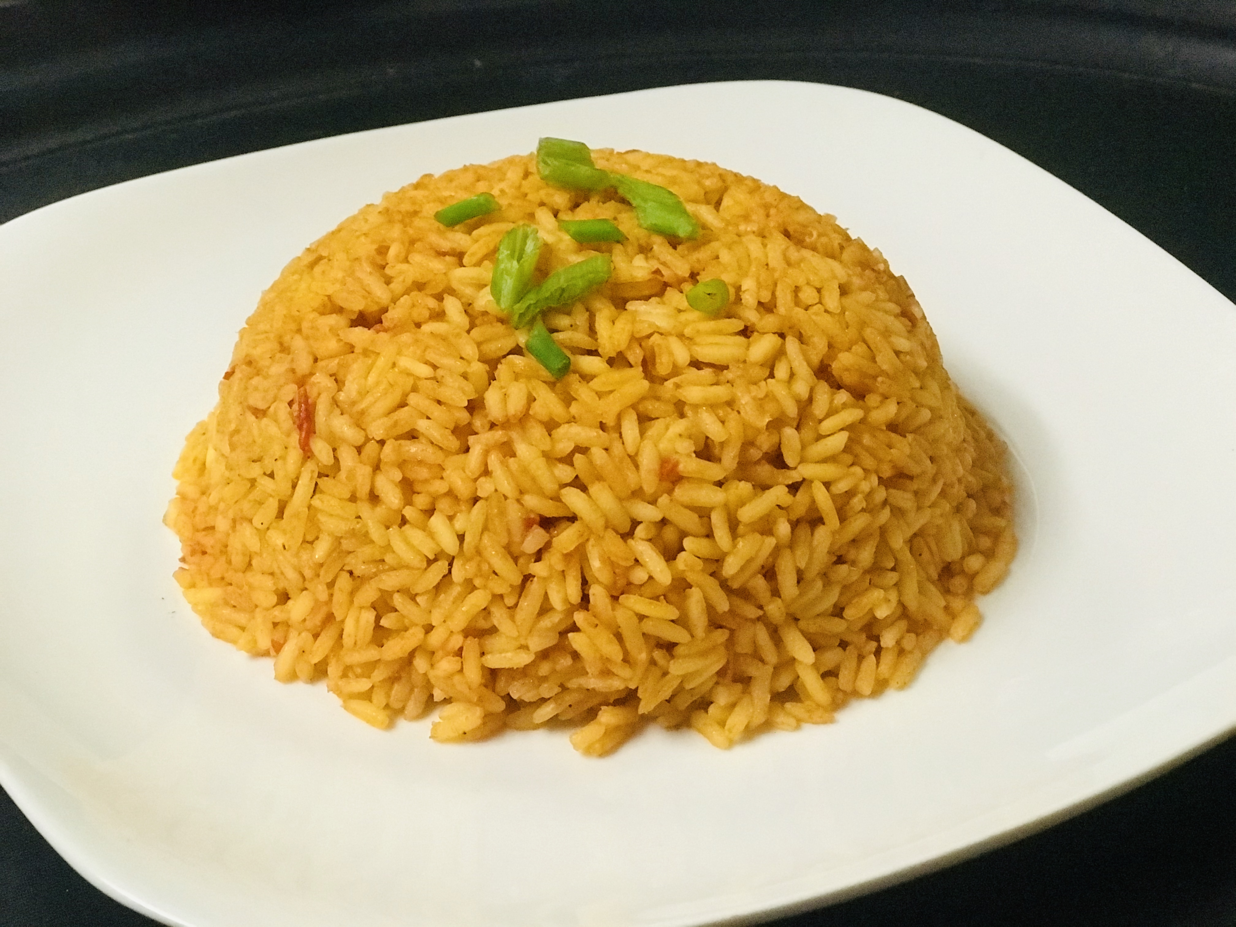 Order Jollof Rice food online from Vee Vee African Restaurant store, Chicago on bringmethat.com