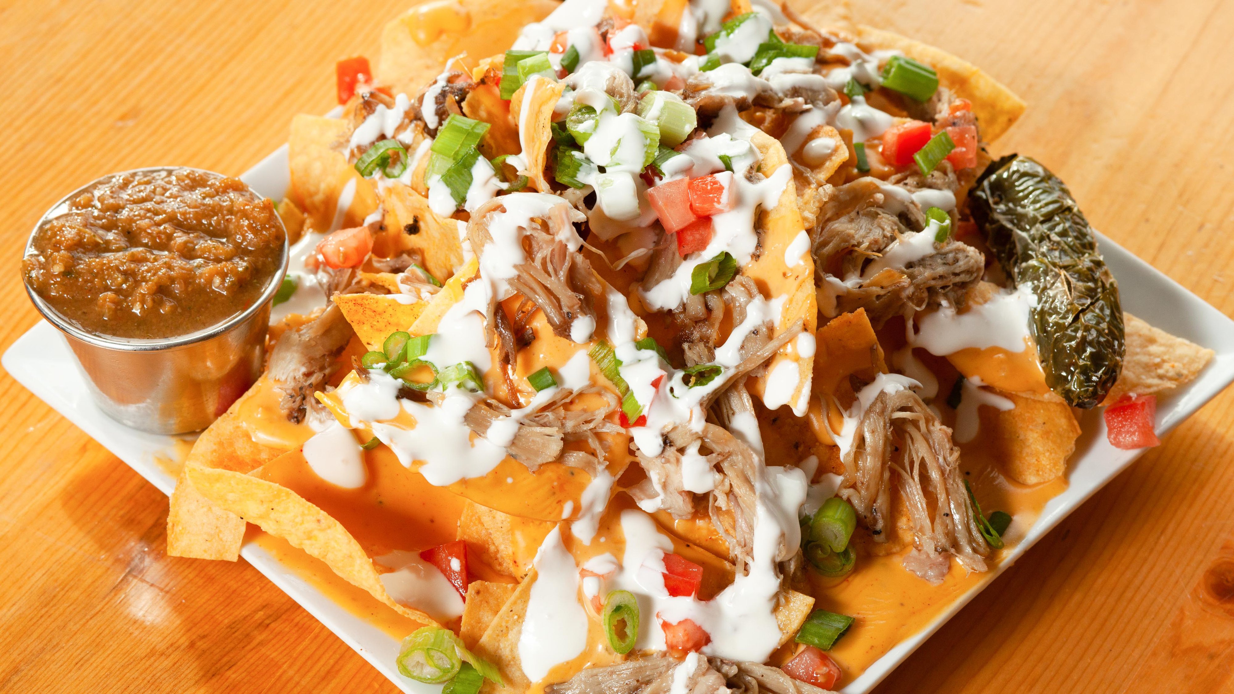 Order Nachos food online from 2 Penguins Tap And Grill store, Centennial on bringmethat.com