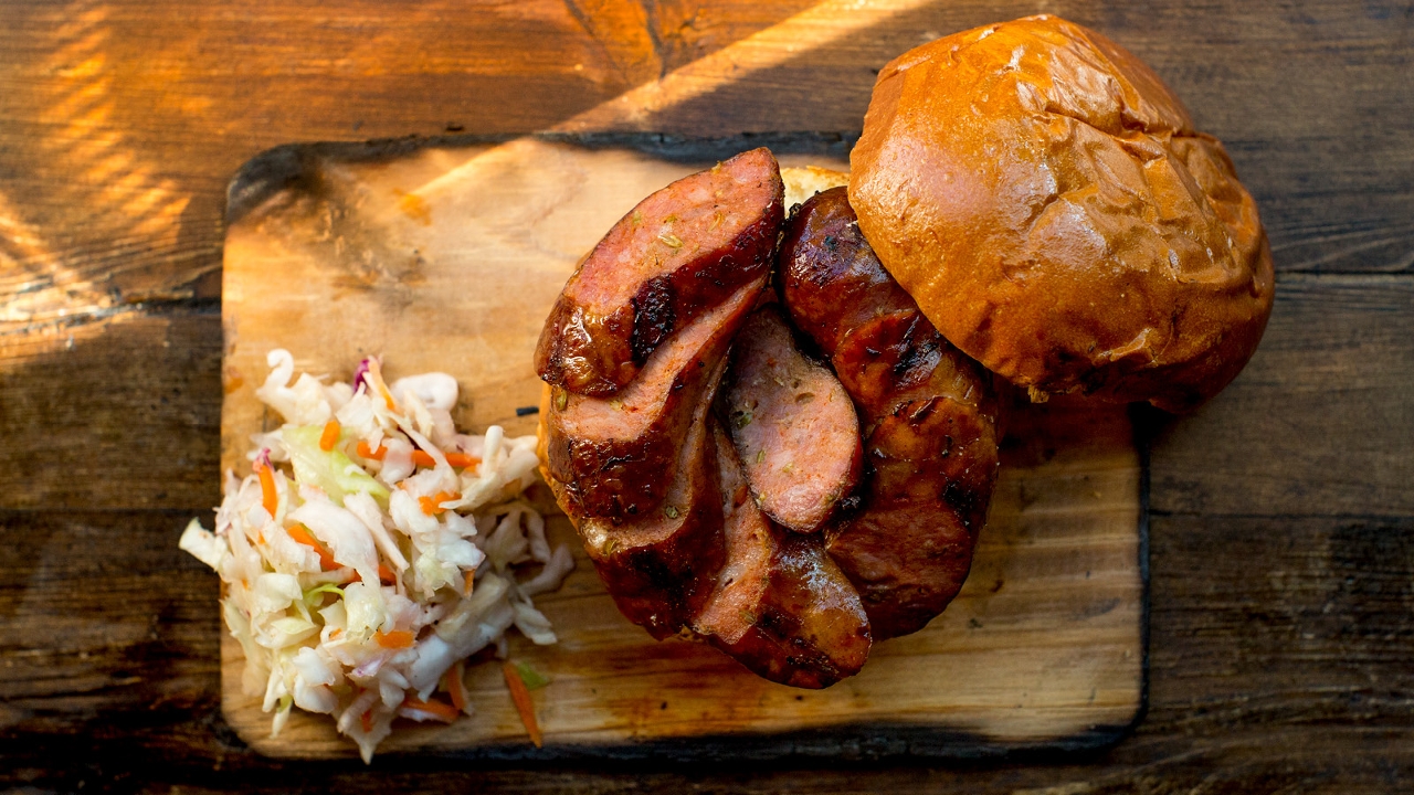 Order Sausage Sandwich food online from Mighty Quinn's Barbeque store, New York on bringmethat.com