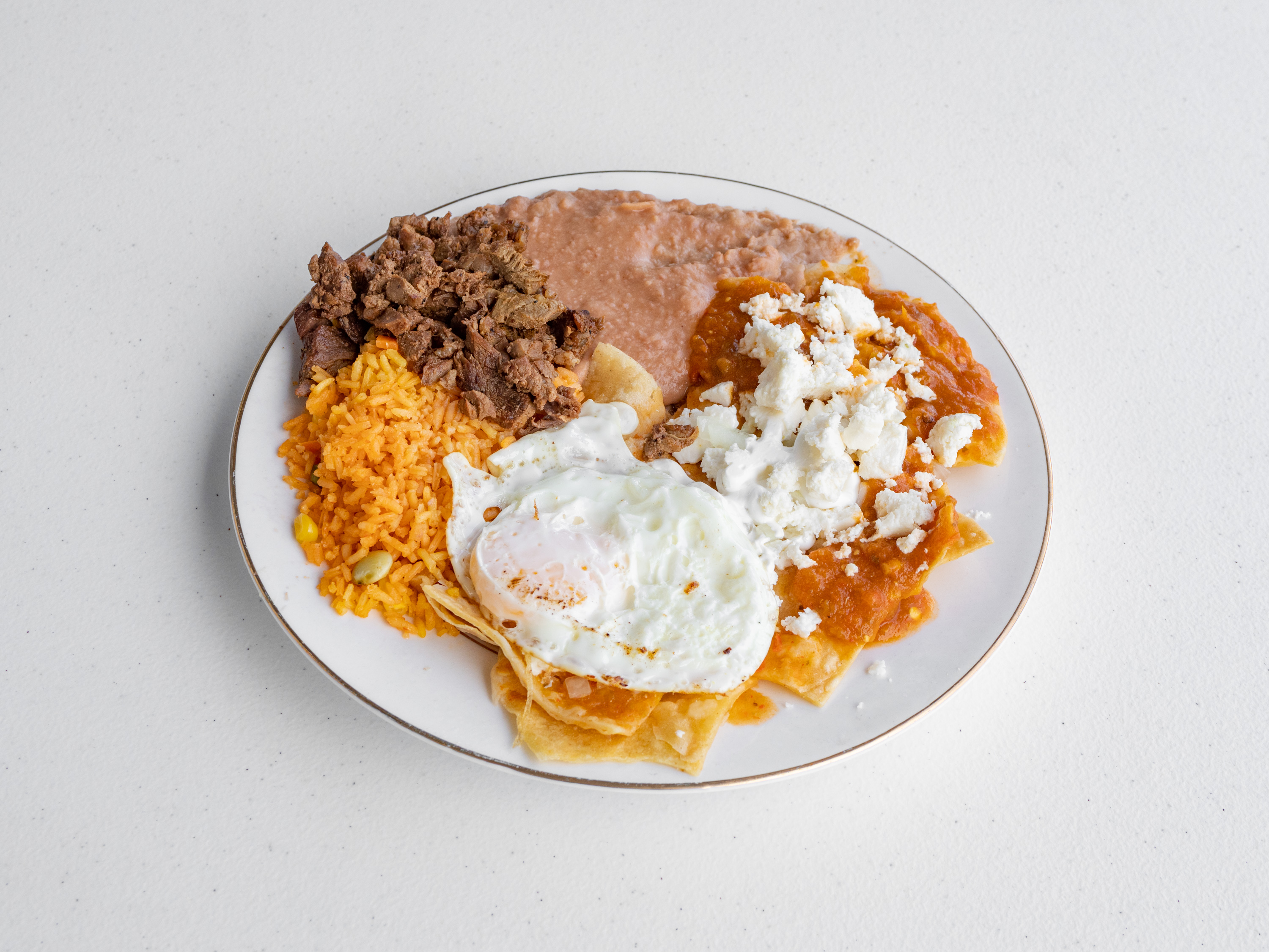 Order Chilaquiles food online from La Mexicana Market store, Round Rock on bringmethat.com