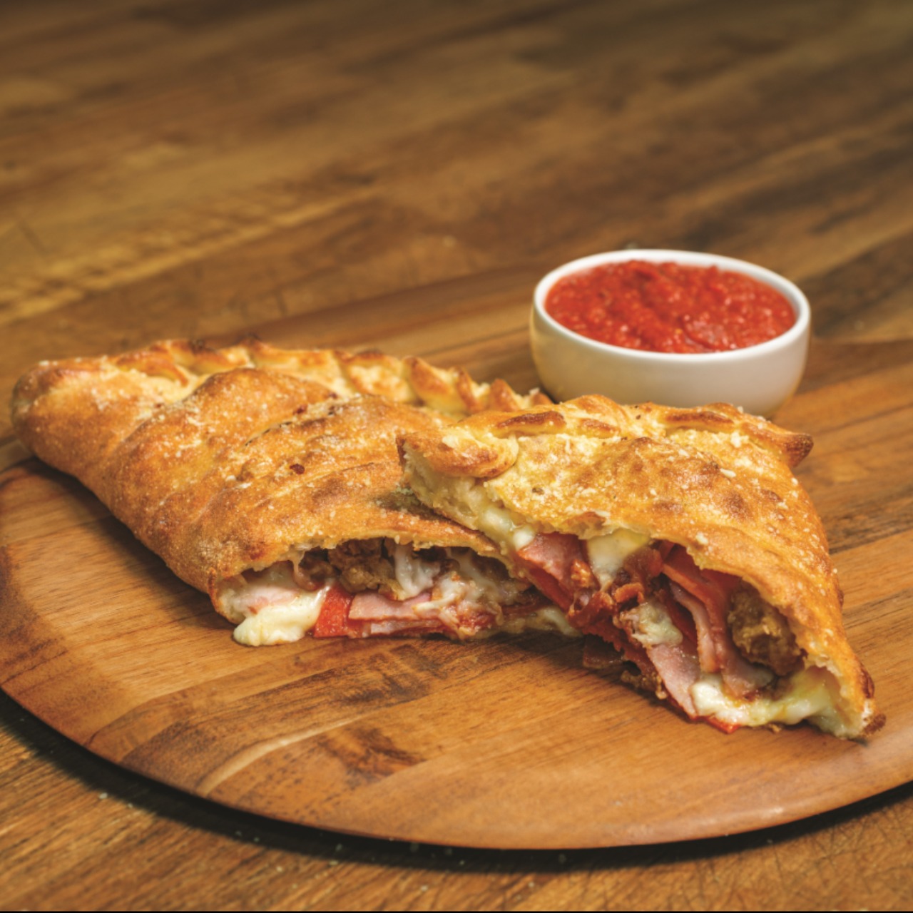 Order All Meat Calzone 	 food online from Marco Pizza store, Live Oak on bringmethat.com