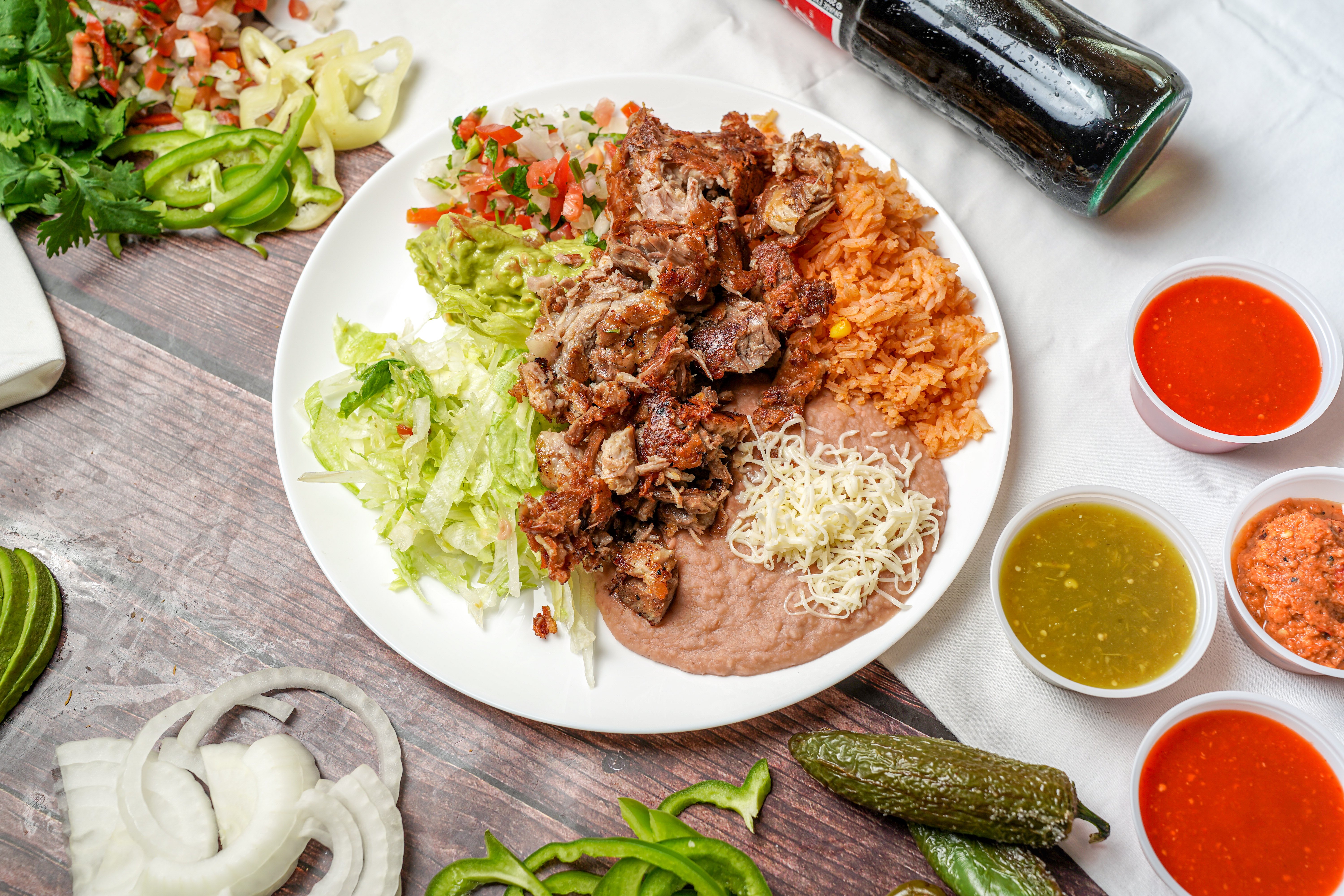 Order #13 Carnitas Plate food online from Albertaco's Mexican Food Inc store, Cypress on bringmethat.com