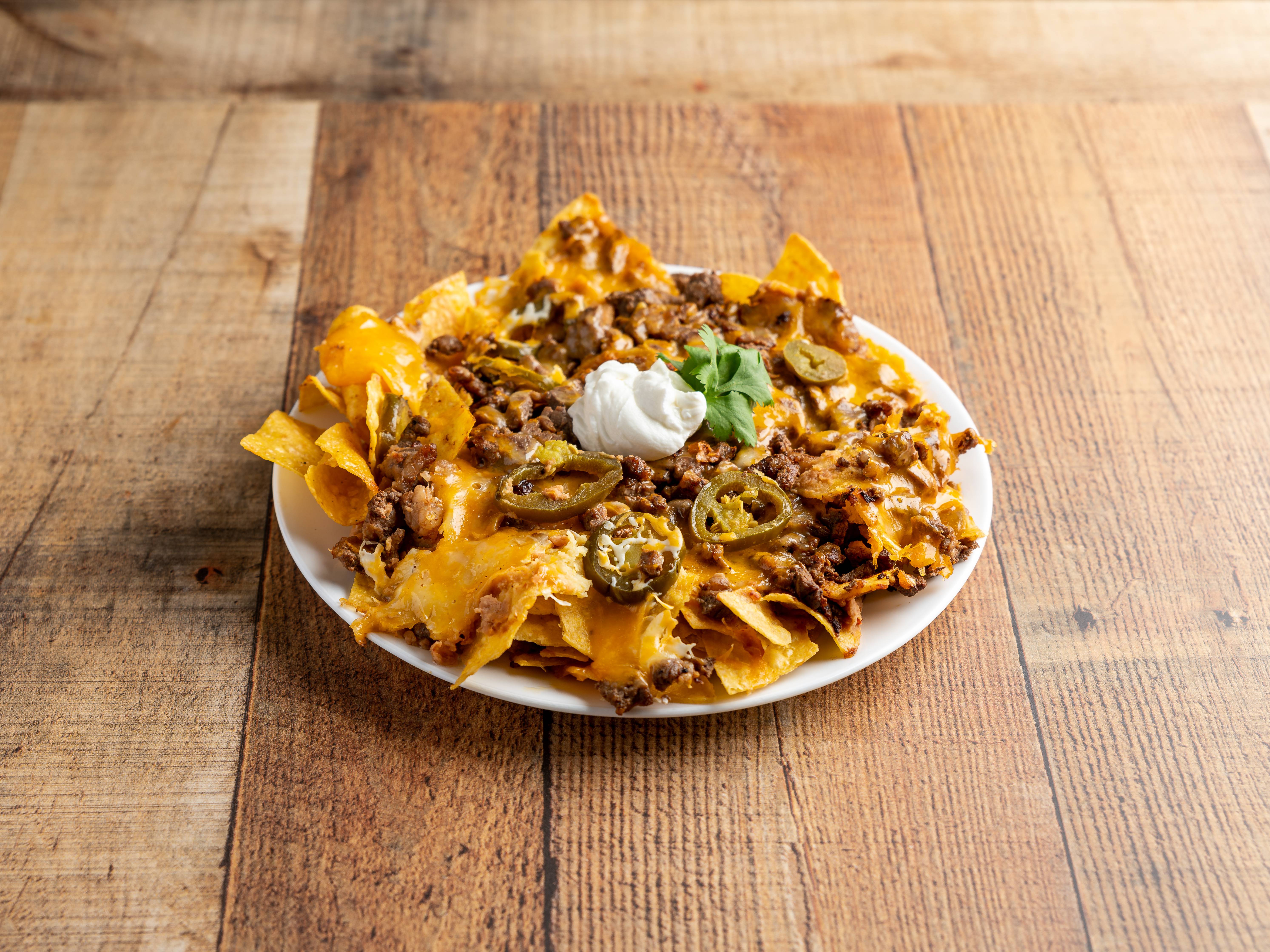 Order Nachos Deluxe food online from Zapata store, Oklahoma City on bringmethat.com