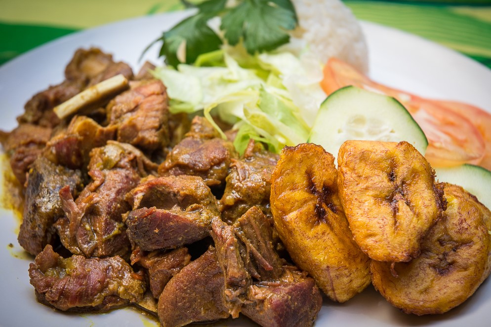 Order Curried Goat Meat Dish food online from Island Jerk store, North Babylon on bringmethat.com