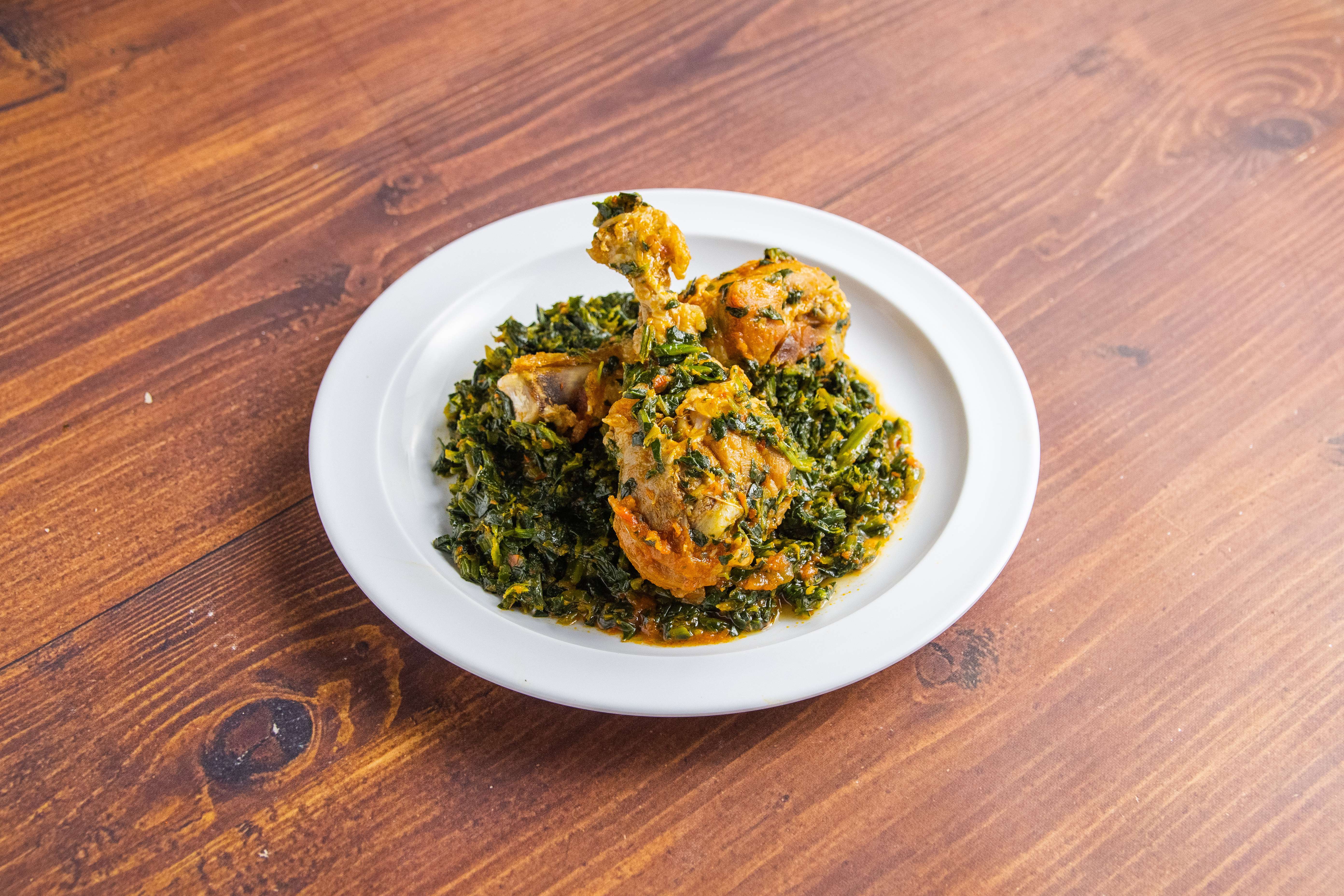 Order Edikanikong (well spiced green spinach) with choice fufu served with either (Chicken, mixed beef meat, Goat, Fresh/Fried fish food online from Sumptuous African Restaurant store, Inglewood on bringmethat.com