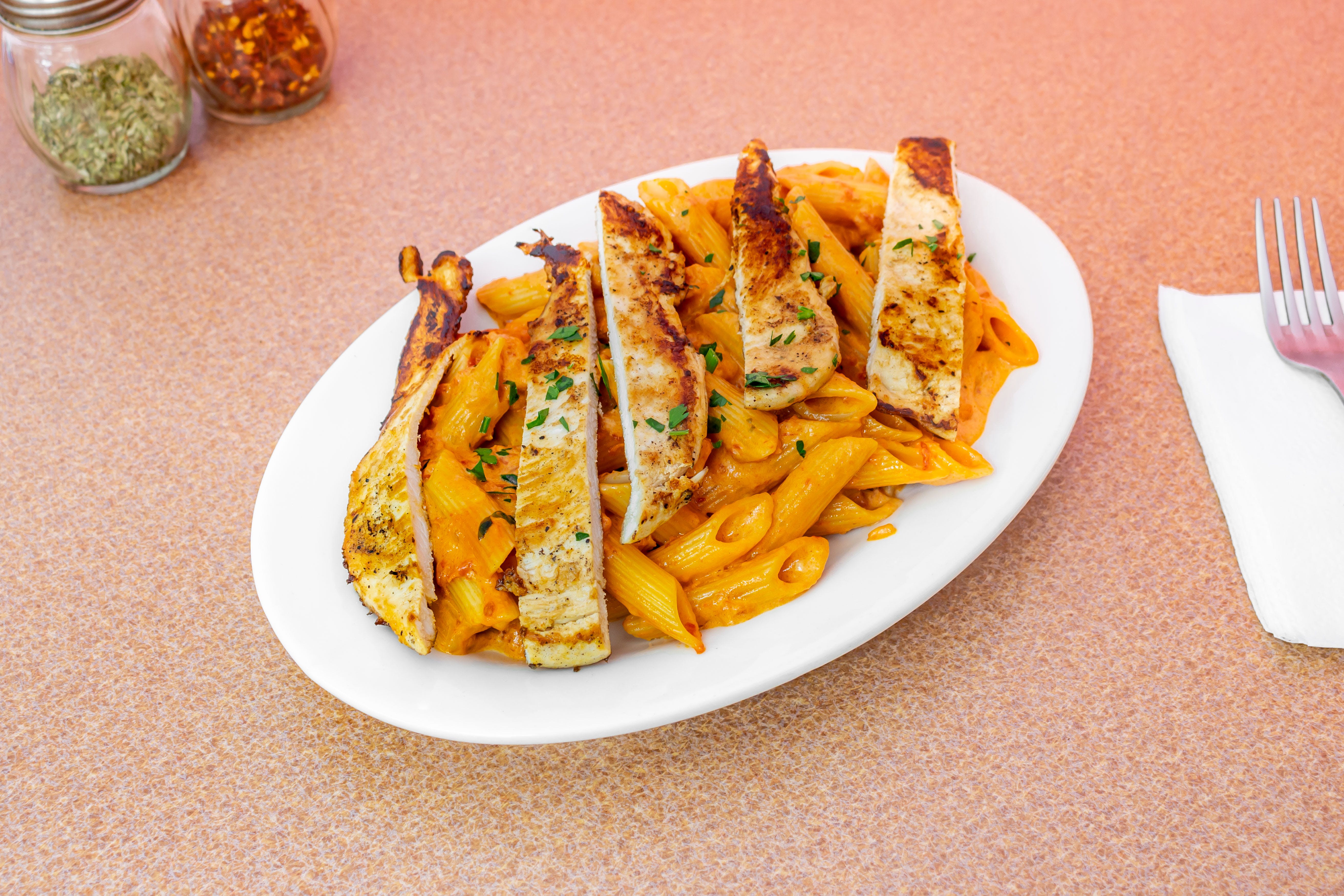 Order Penne ala Vodka with Grilled Chicken - Pasta food online from I Love NY Pizza store, Yonkers on bringmethat.com
