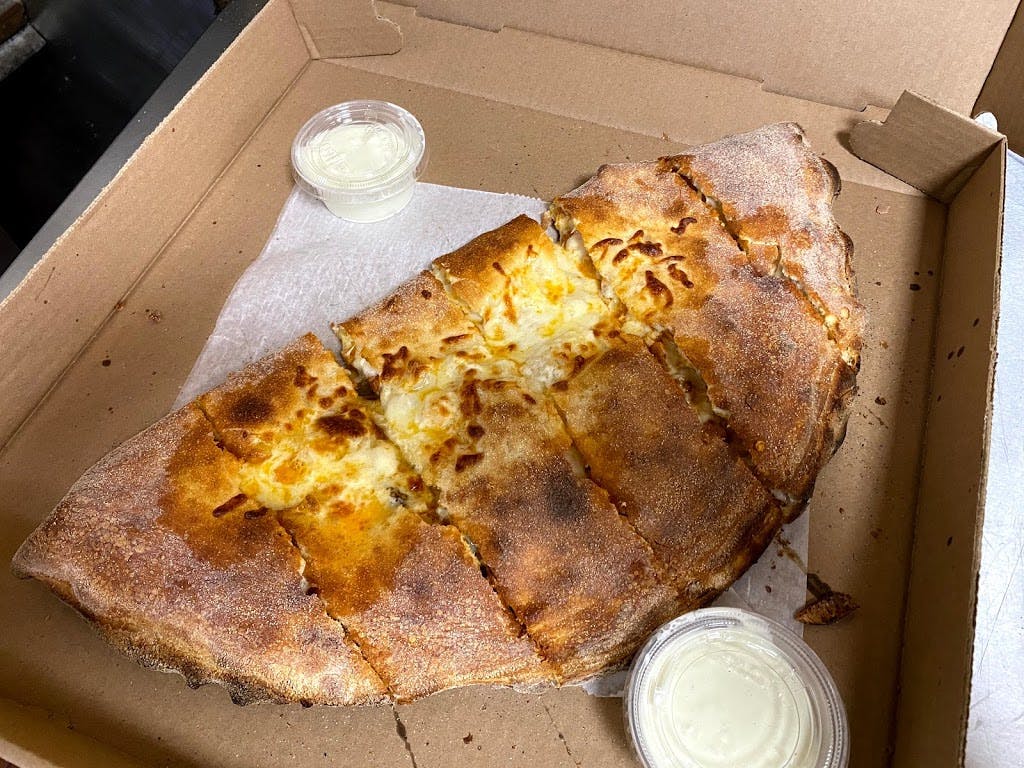 Order Pepperoni & Cheese CALZONE - MEDIUM food online from Mama Ginas store, Somerville on bringmethat.com