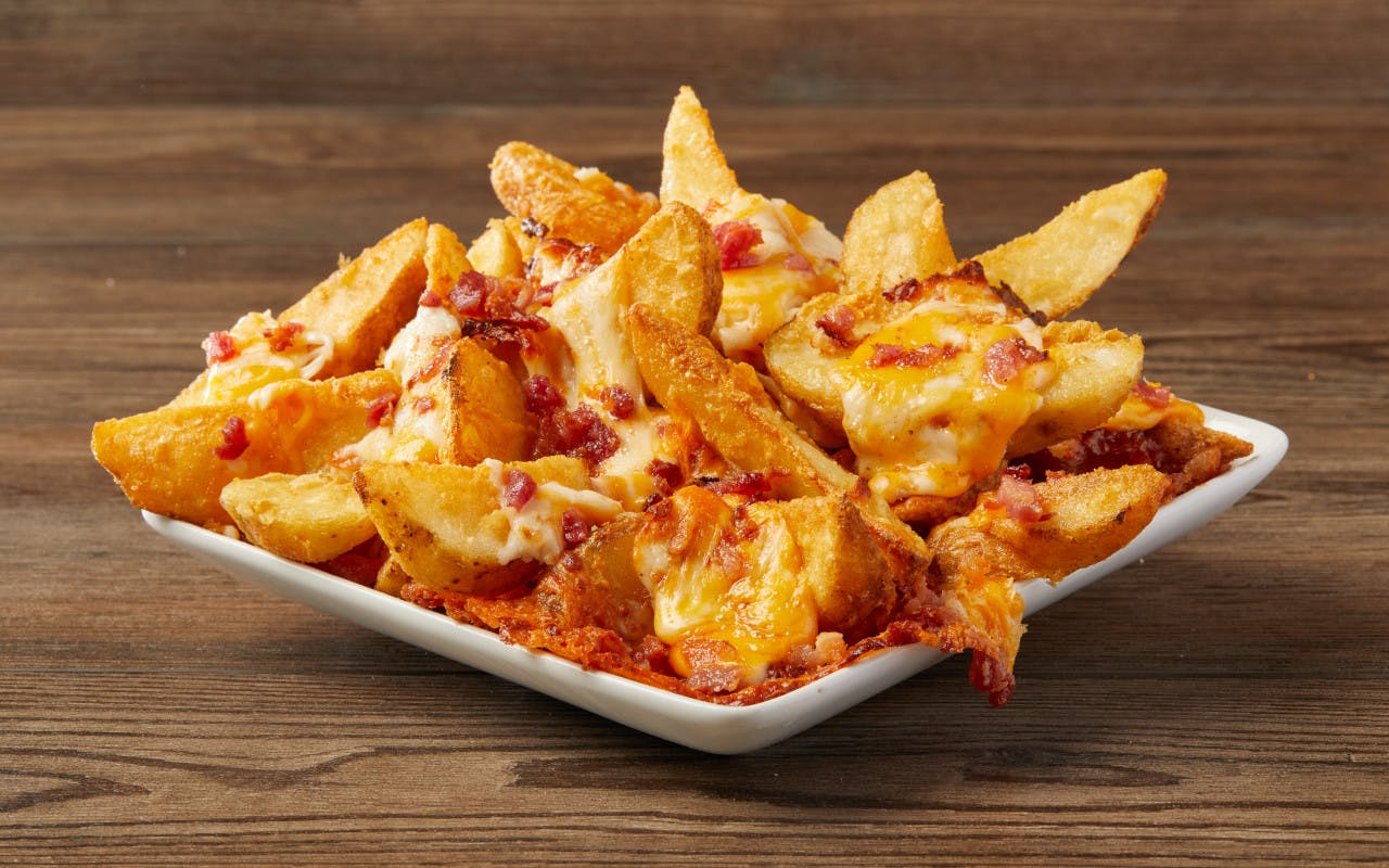 Order Bacon Cheddar Fries - Side food online from Fox Pizza Den store, Aliquippa on bringmethat.com