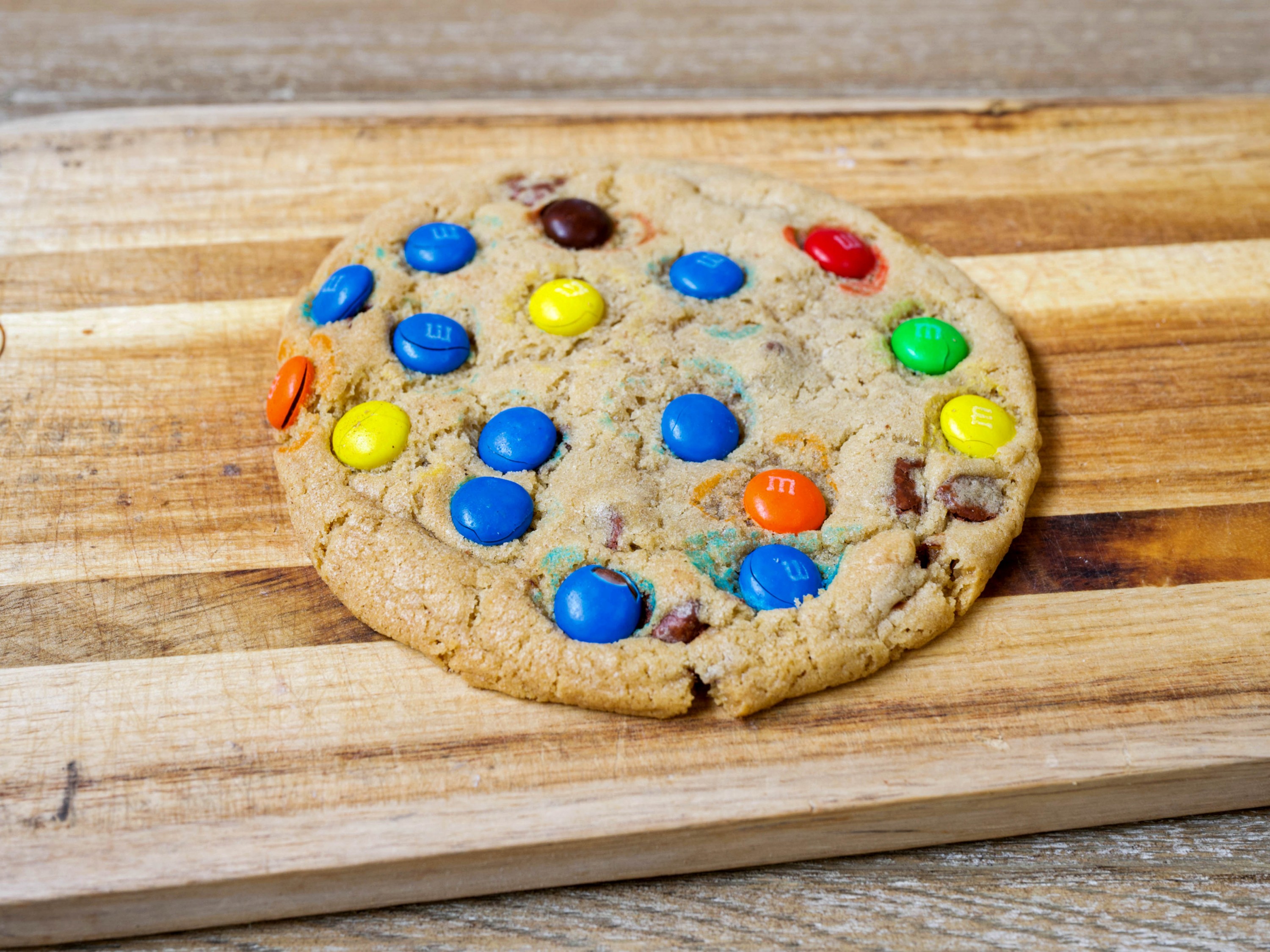 Order 1/4 lb. M&M Chocolate Chip Cookie food online from Mary Mountain Cookies store, Broomfield on bringmethat.com