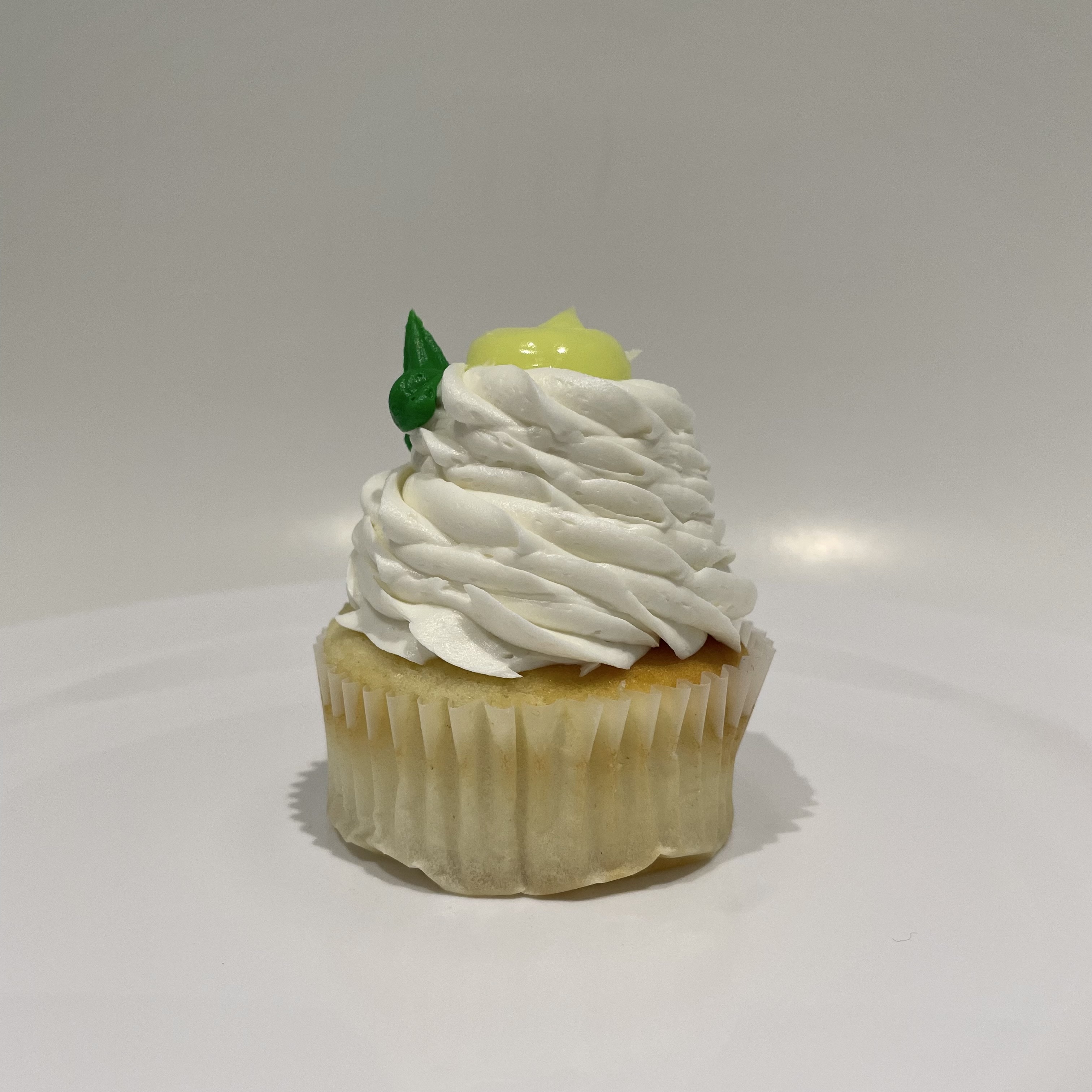 Order Key Lime Cupcake food online from The House of Cupcakes store, Princeton on bringmethat.com