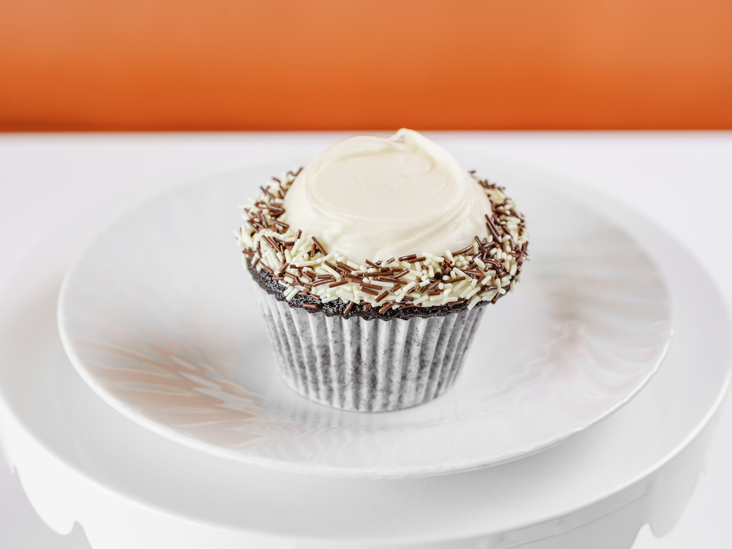 Order Chocolate / Vanilla Buttercream Cupcake food online from Frosted Cupcakery store, Long Beach on bringmethat.com