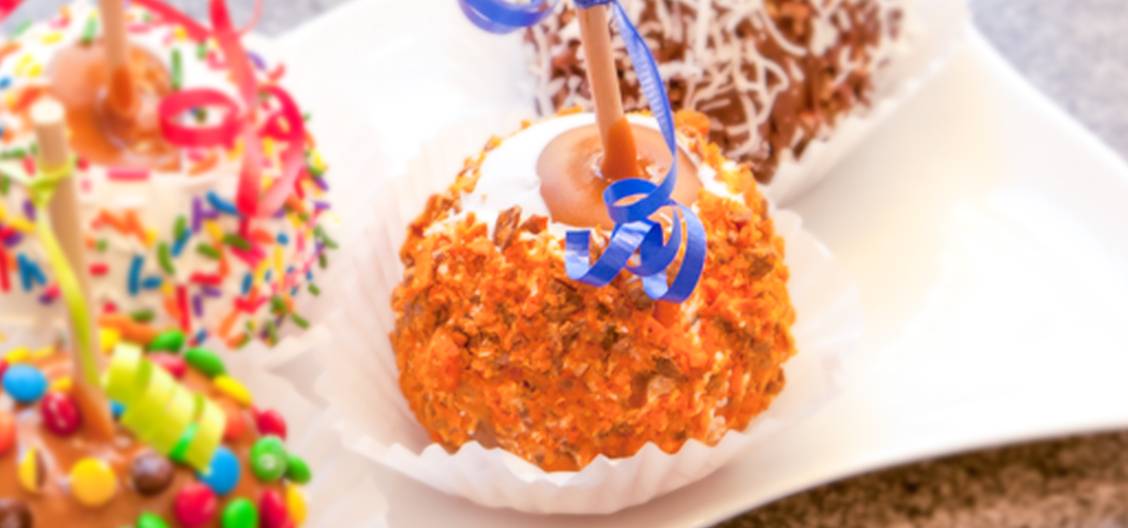 Order Butterfinger® Caramel Apple food online from Rocky Mountain Chocolate Factory store, Irvine on bringmethat.com