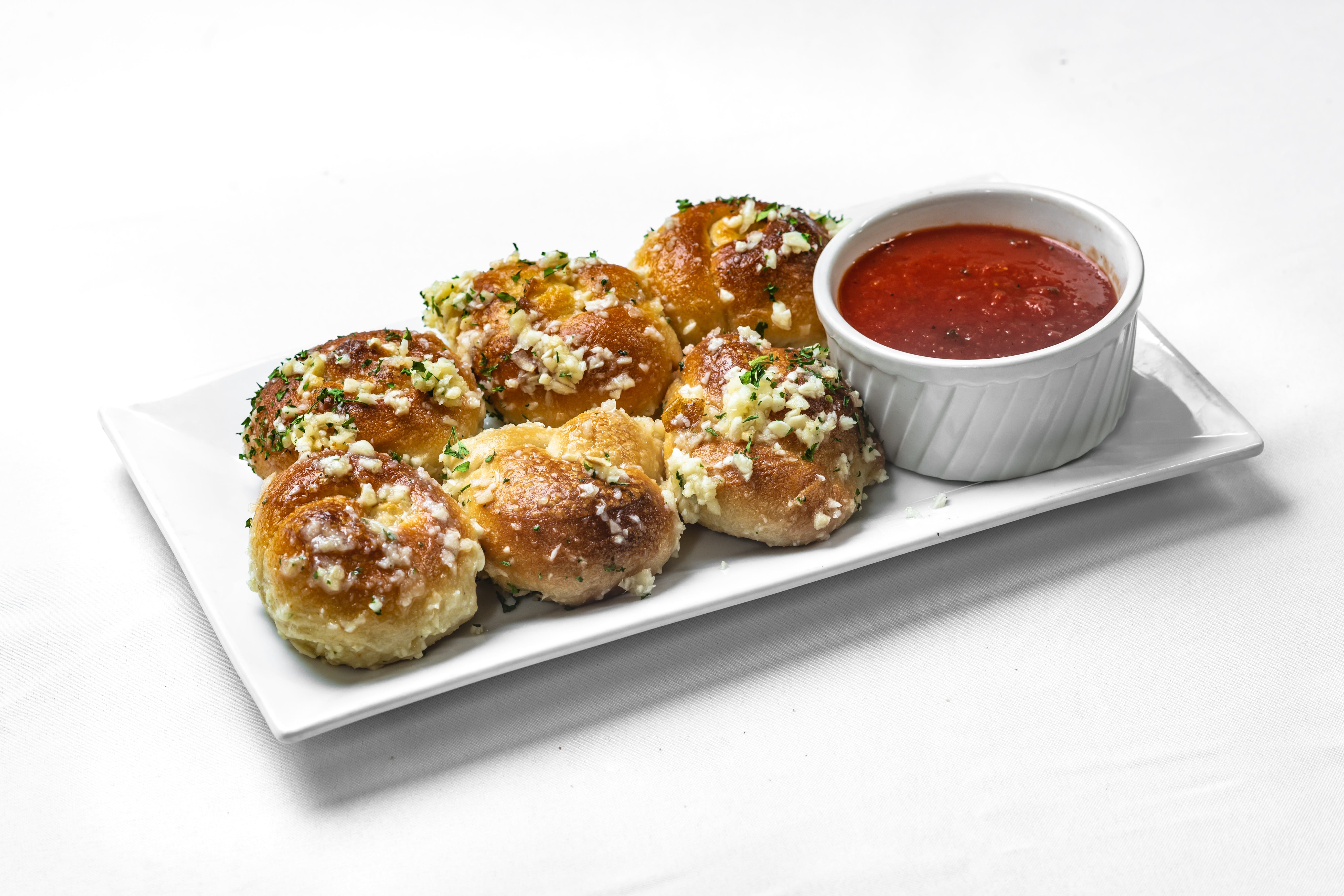 Order Garlic Knots - 6 Pieces food online from Leo's Pizza Italian Restaurant store, Washington on bringmethat.com