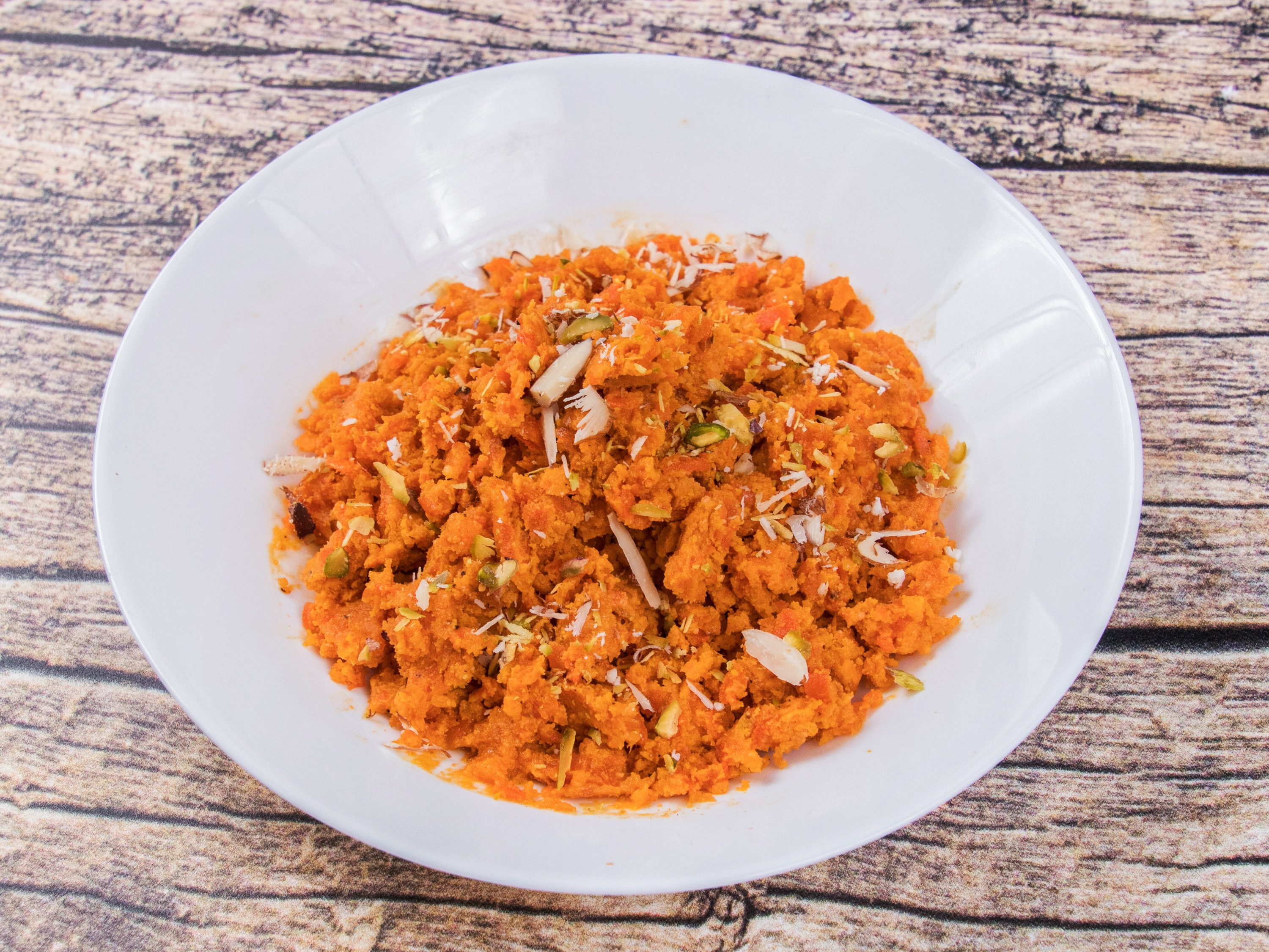 Order Carrot Halwa food online from Royal Sweets store, Decatur on bringmethat.com