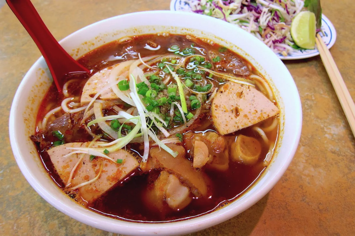 Order V048. Bun Bo Hue (Spicy) food online from Pho Noodle Station & Bubble Tea House store, Downers Grove on bringmethat.com