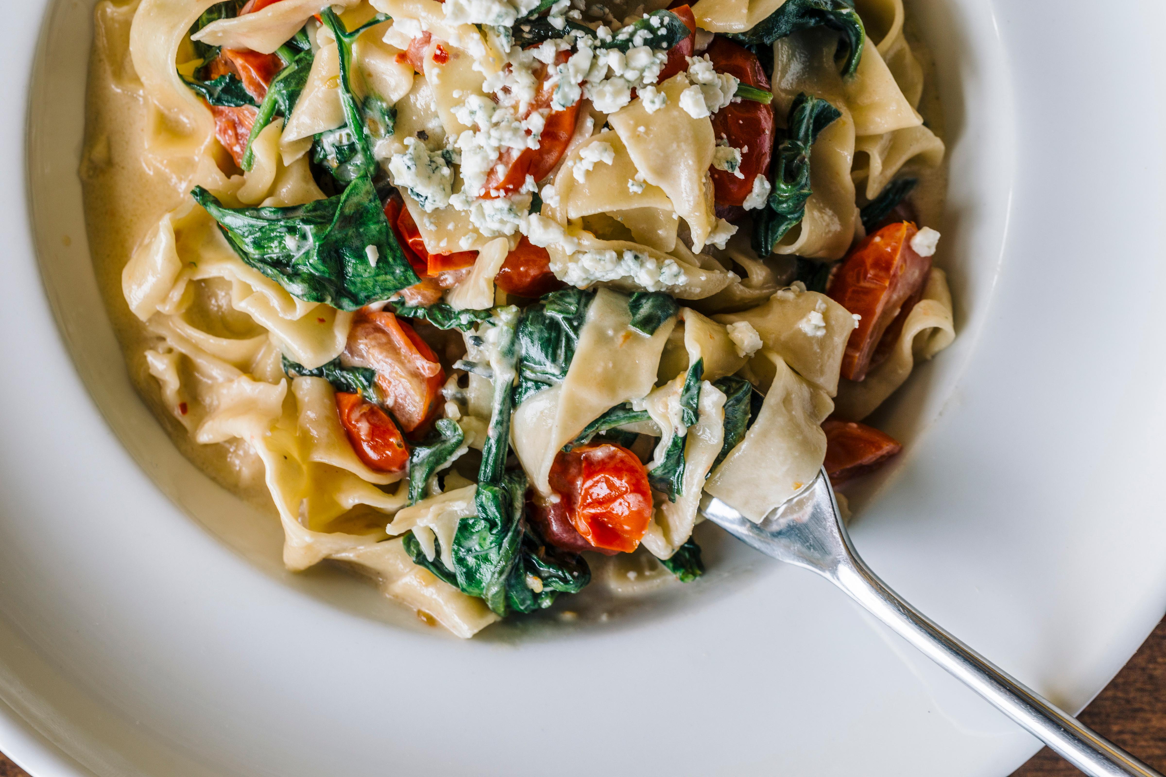 Order Spinach, Tomato and Gorgonzola w/ Fresh Pappardelle Pasta (V) food online from Nirvana Wine & Grillerie store, Vernon Hills on bringmethat.com
