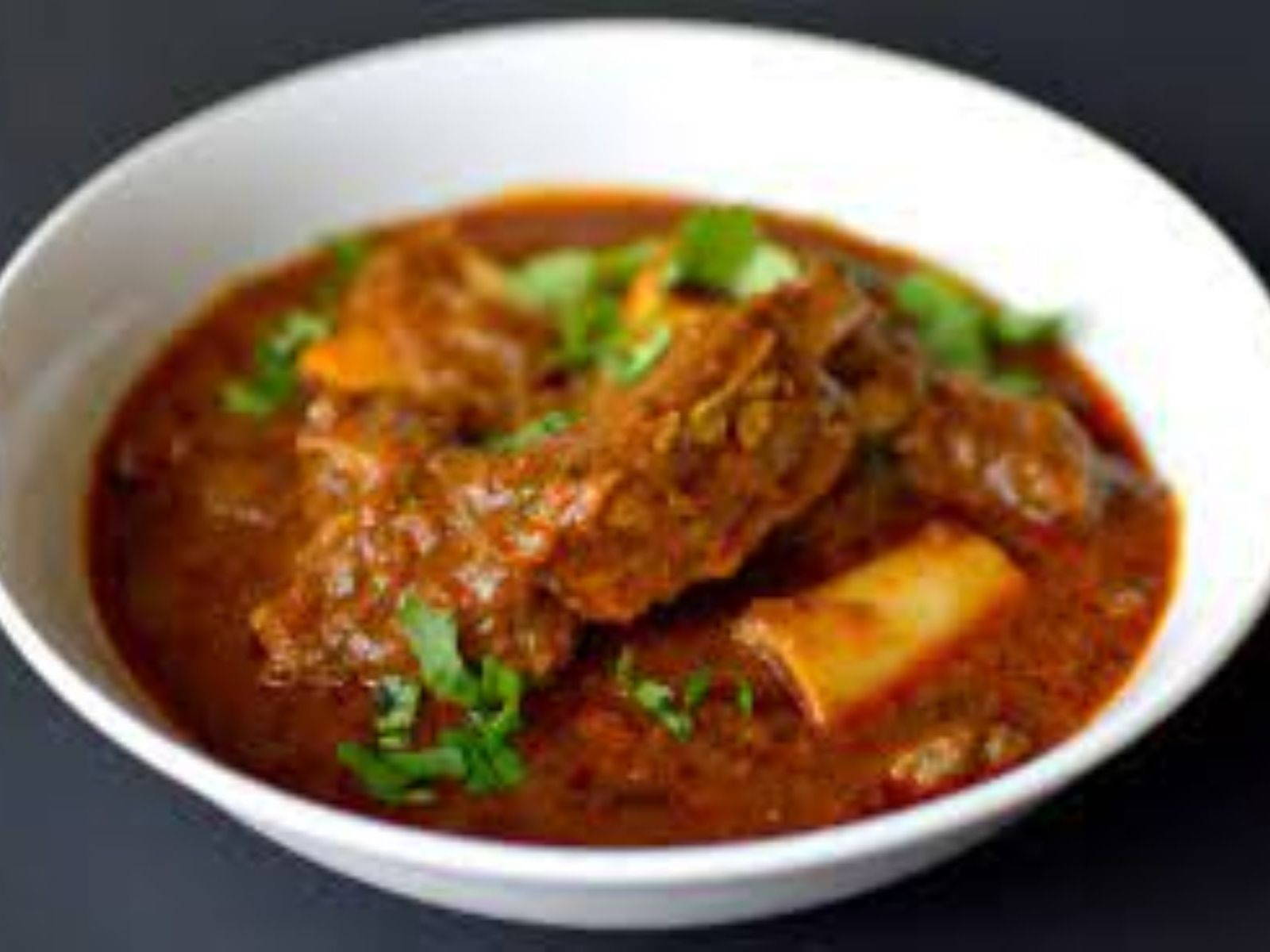 Order Goat Curry (HALAL) food online from Passage to India store, Cambridge on bringmethat.com