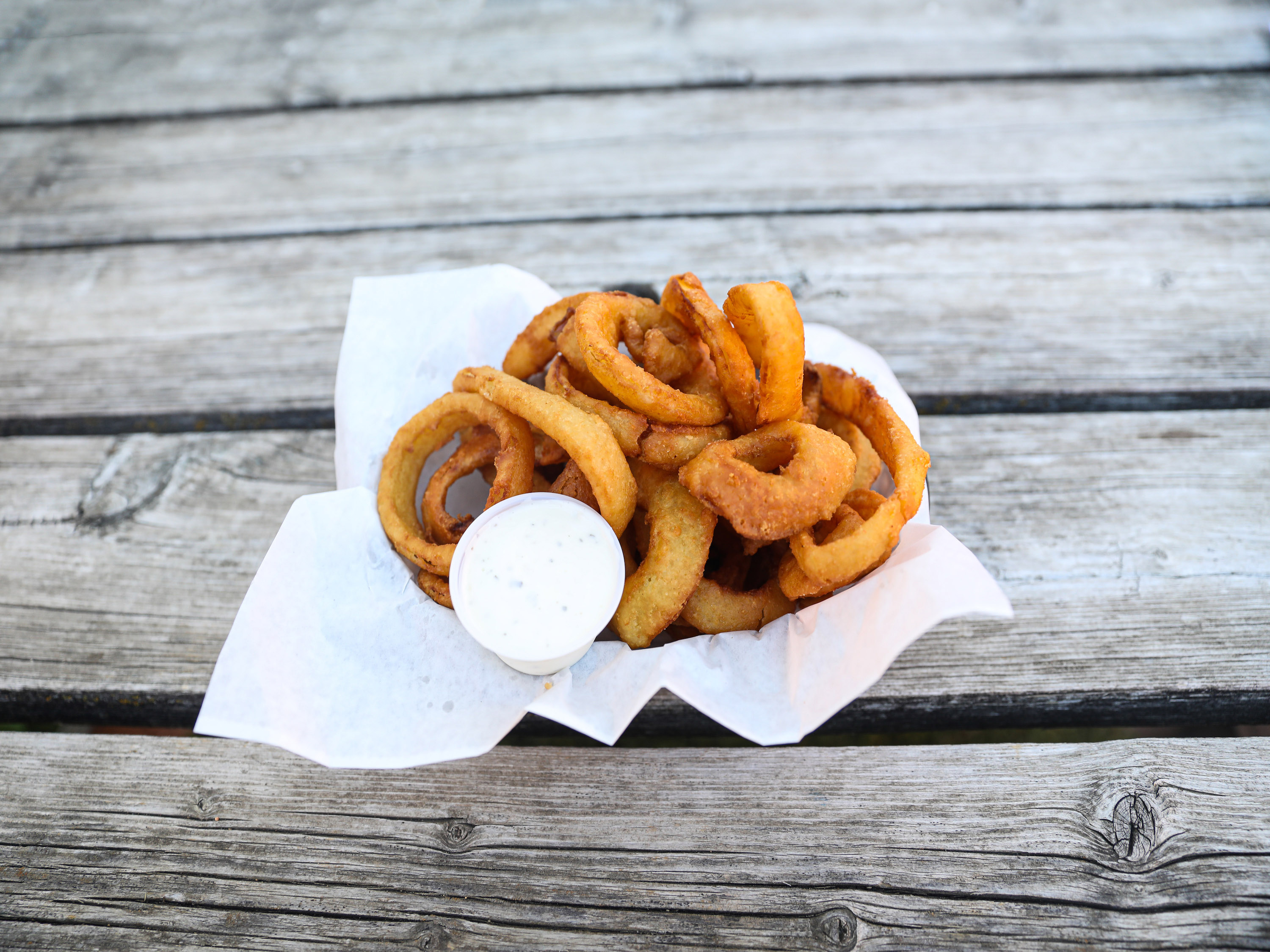 Order Onion Rings food online from Steinbeck's Pub Sports Bar & Grill store, Sioux City on bringmethat.com