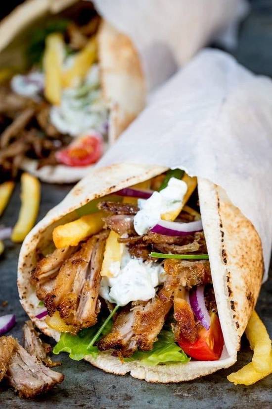 Order Greek Chicken Wrap food online from East and Feast Lounge store, Austin on bringmethat.com