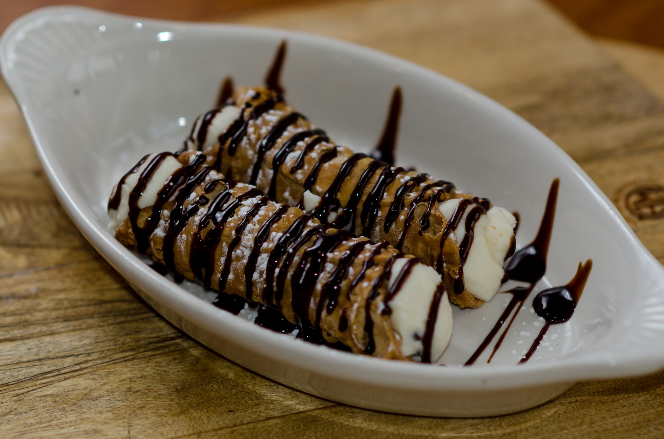 Order 2 Cannoli with Chocolate Sauce food online from Bacci's Pizza & Pasta - Carrollton store, Carrollton on bringmethat.com