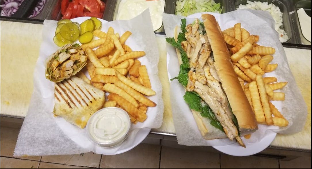 Order Smothered Grilled Chicken Sub - 12'' food online from Supreme Pizza & Grill store, Lumberton on bringmethat.com