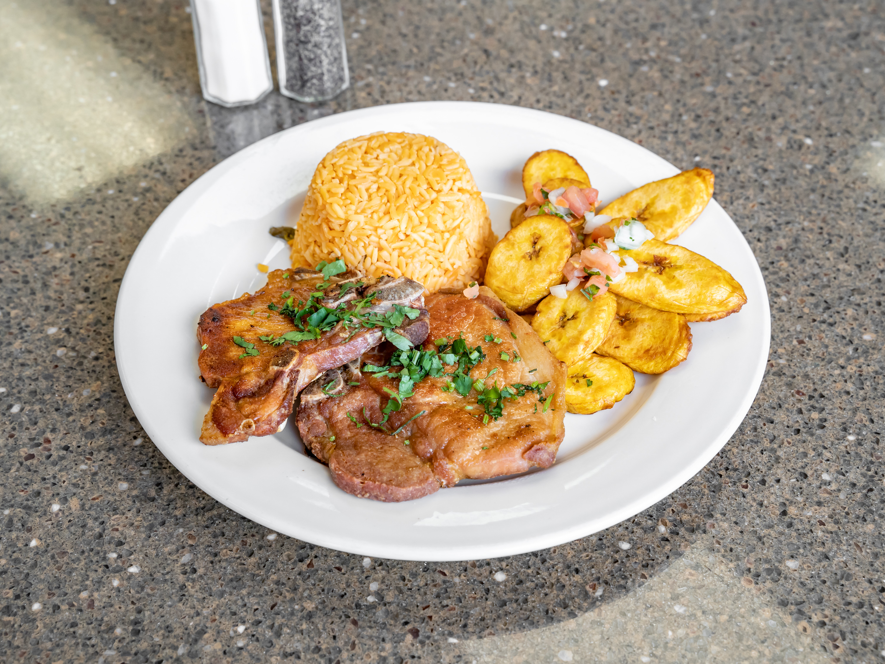 Order Chuletas Fritas con Maduros food online from The Avocado Mexican Grill store, Runnemede on bringmethat.com