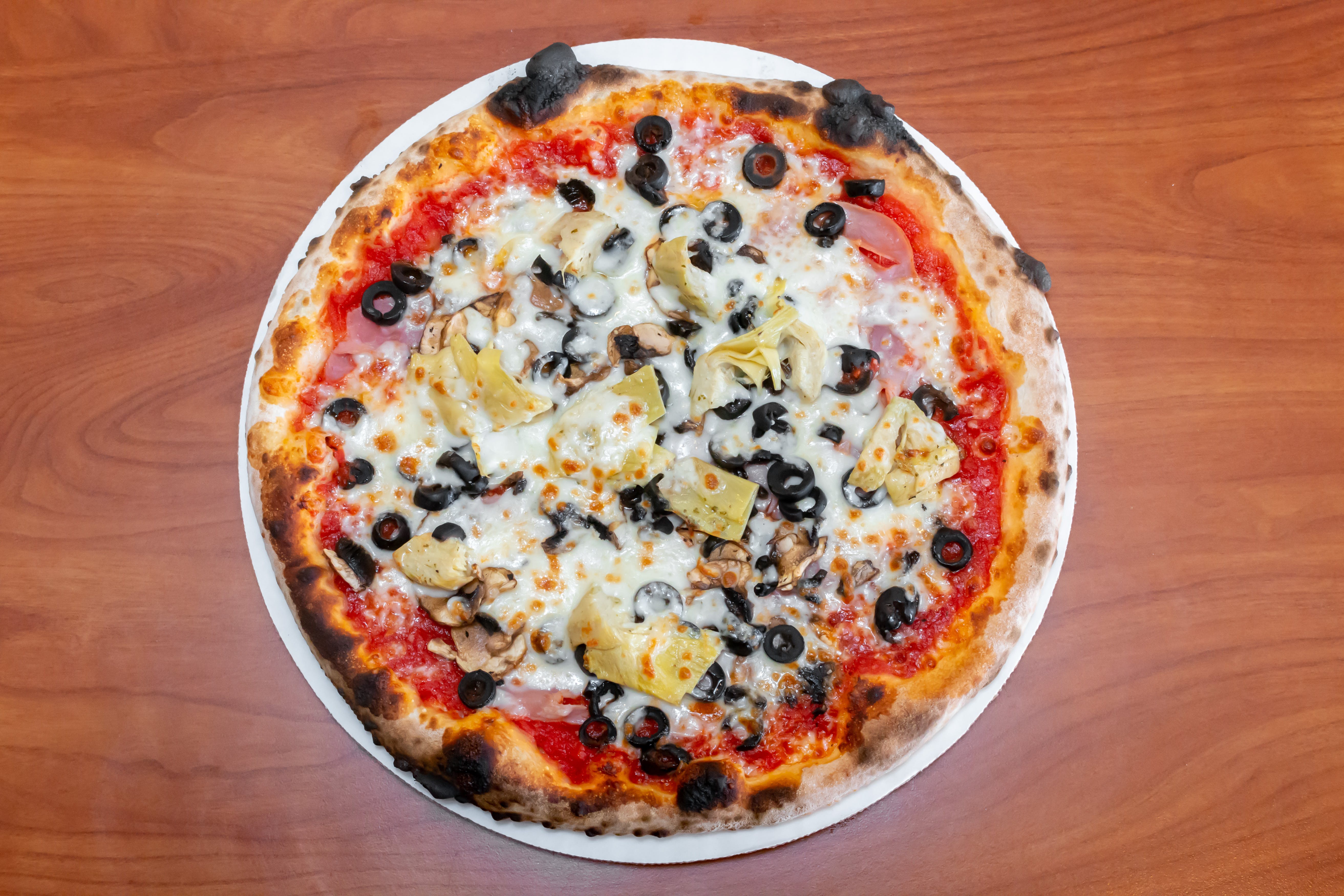 Order Four Stragione Pizza - Medium 12'' (8 Slices) food online from Serino's Italian Deli store, Addison on bringmethat.com