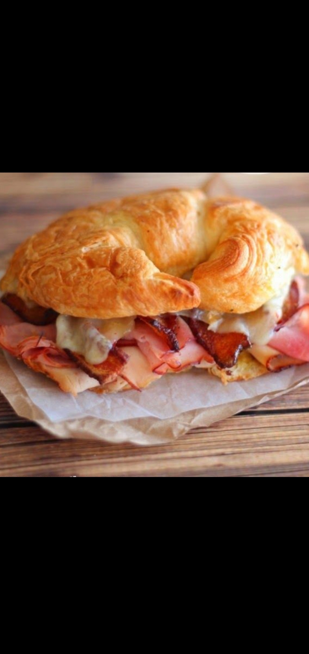 Order  Bacon, Ham & Turkey Melt Cheese Breakfast Croissant Sandwich  food online from American Gourmet Foods Deli store, New York on bringmethat.com