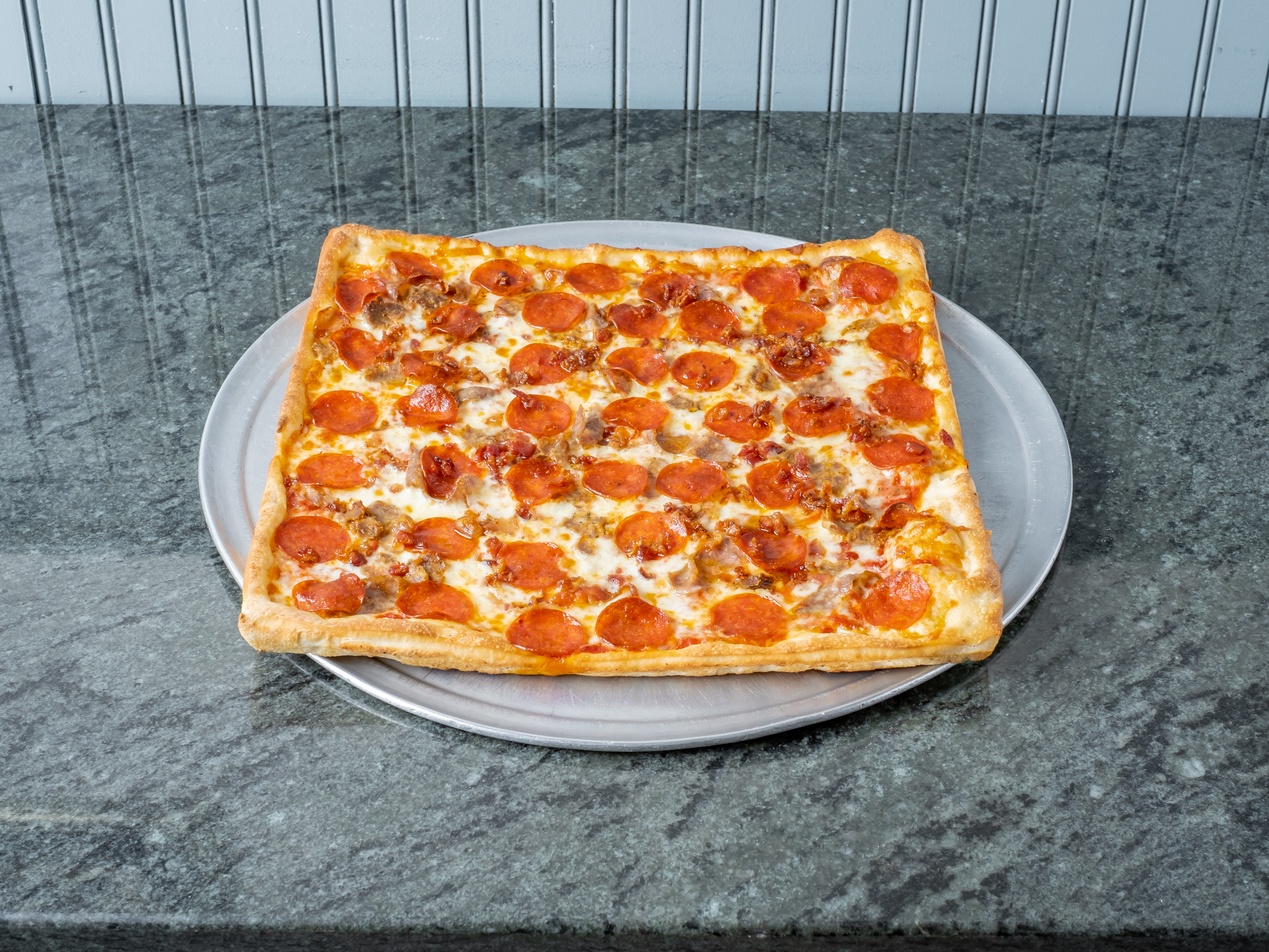 Order Meat Lovers Pizza food online from Main Street Pizza store, Tarrytown on bringmethat.com